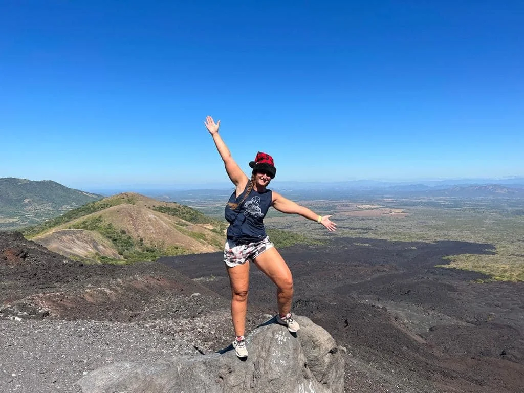 View from Cerro Negro volcano in Nicaragua with landscape and traveler