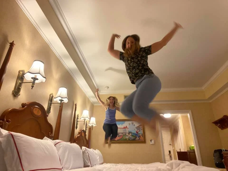 jumping on bed in disney hotel hong kong travel