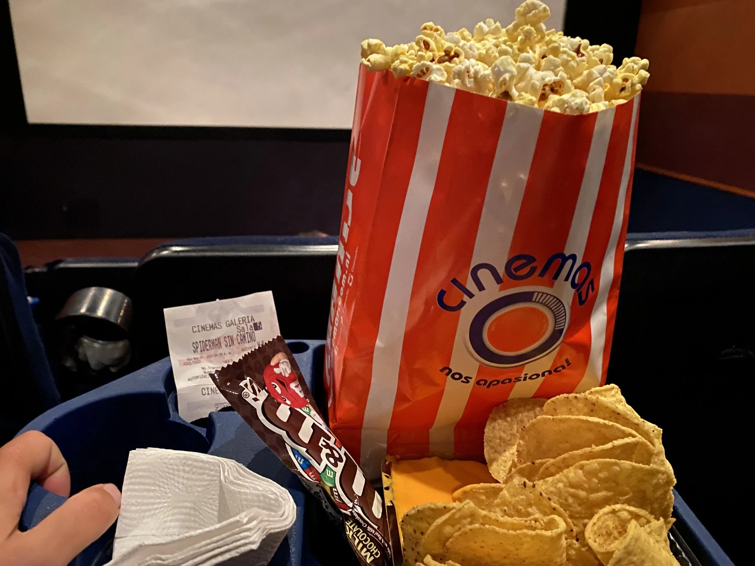 Popcorn, nachos, and candy at a movie theater in Managua, Nicaragua during a solo travel night