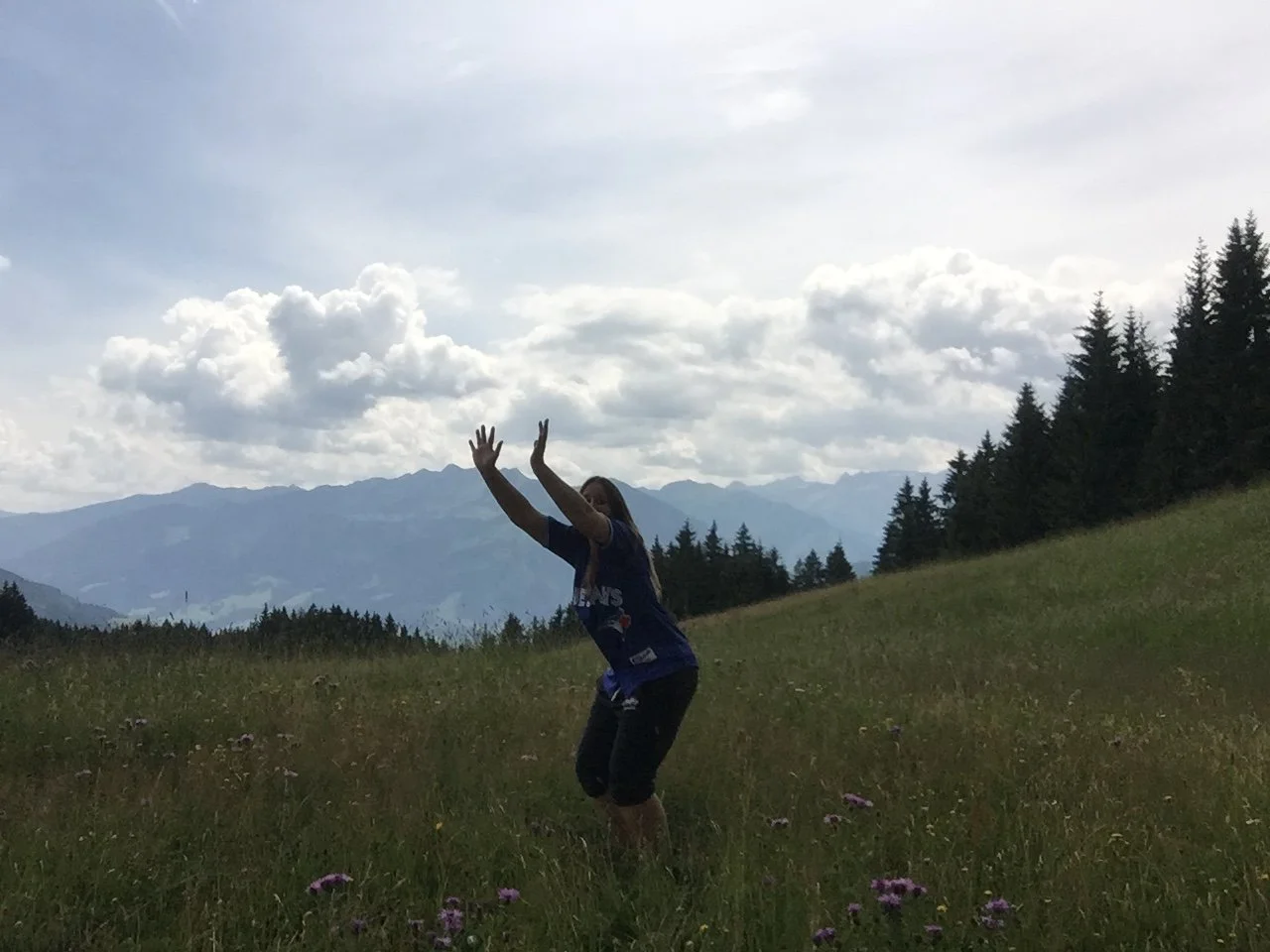 Attempting a jumping photo in the Austrian Alps, capturing a funny outtake instead of the perfect pose.