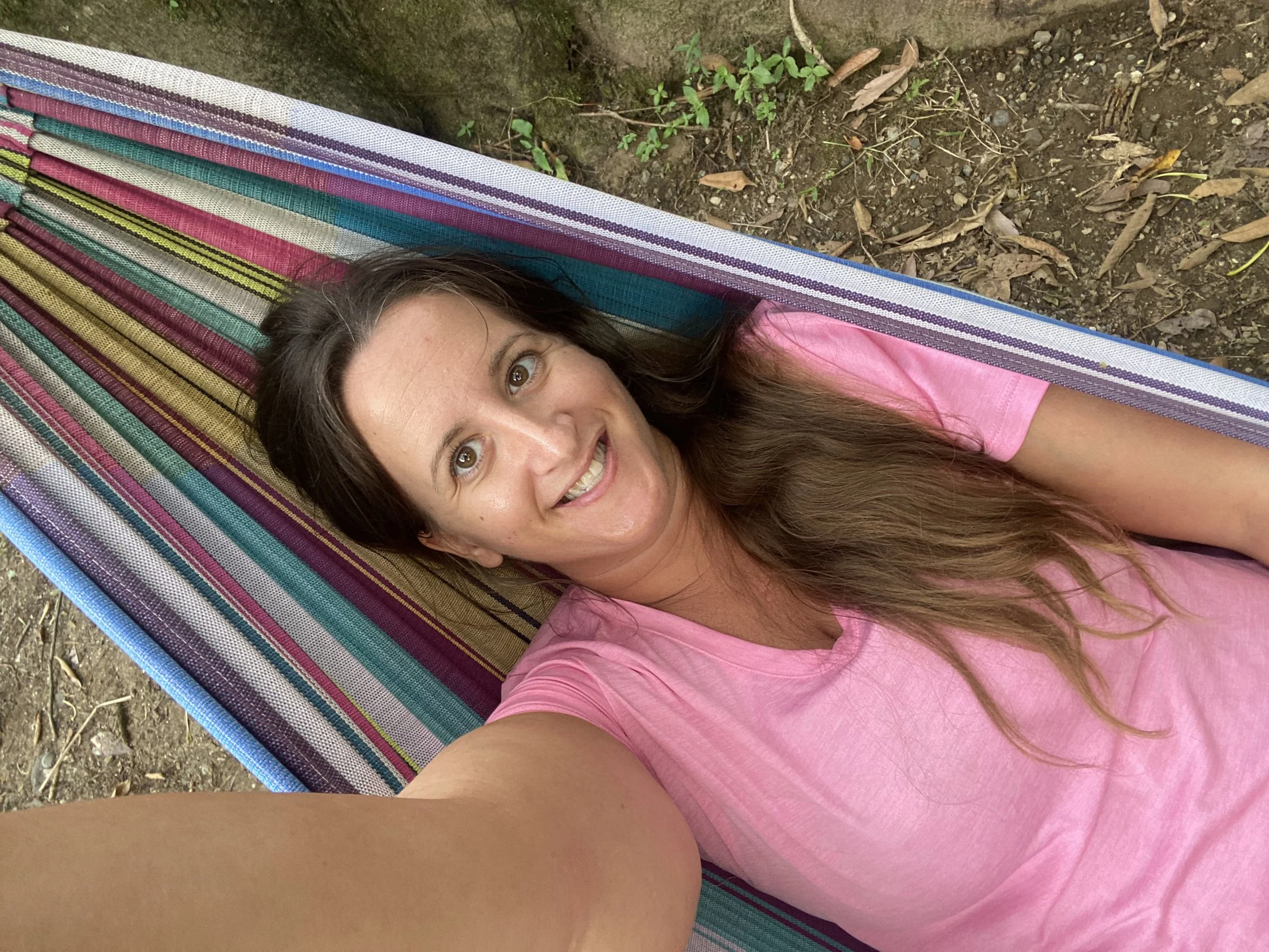 Woman lying in hammock in Lanquin Guatemala during travel trying to relax but feeling restless