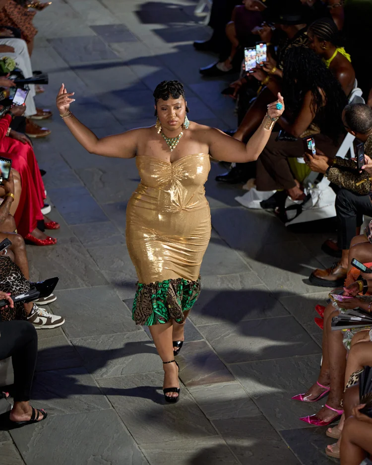 A mom walking the Free Mama runway
