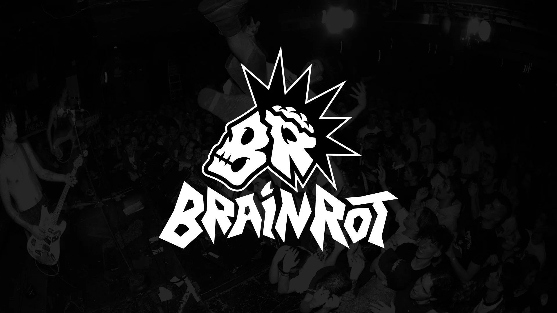 Band performing on stage with large crowd in the background, featuring a logo with a skull and bold text reading "BRAINDRO" in the foreground.