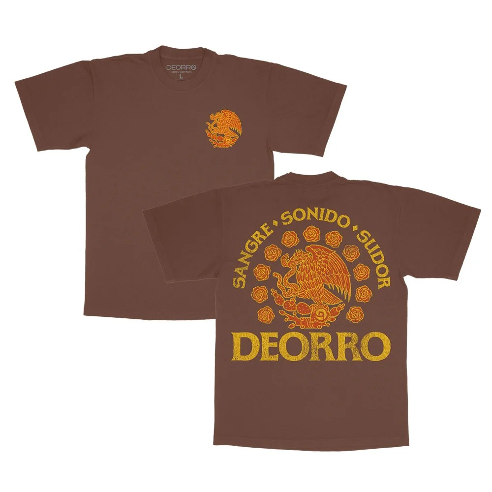 Brown T-shirt with a yellow and orange graphic of a dragon and roses on the front, and the text "SANGRE SONIDO SURDOR DEORRO" and a large "DEORRO" on the back.