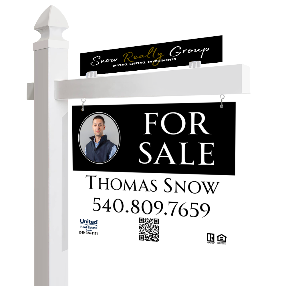 Real estate for sale sign featuring a photograph of a man, contact number, and the real estate agent's name Thomas Snow, under the Snow Realty Group branding. The sign is hanging from a post and has a rider above it with the Snow Realty Group logo.