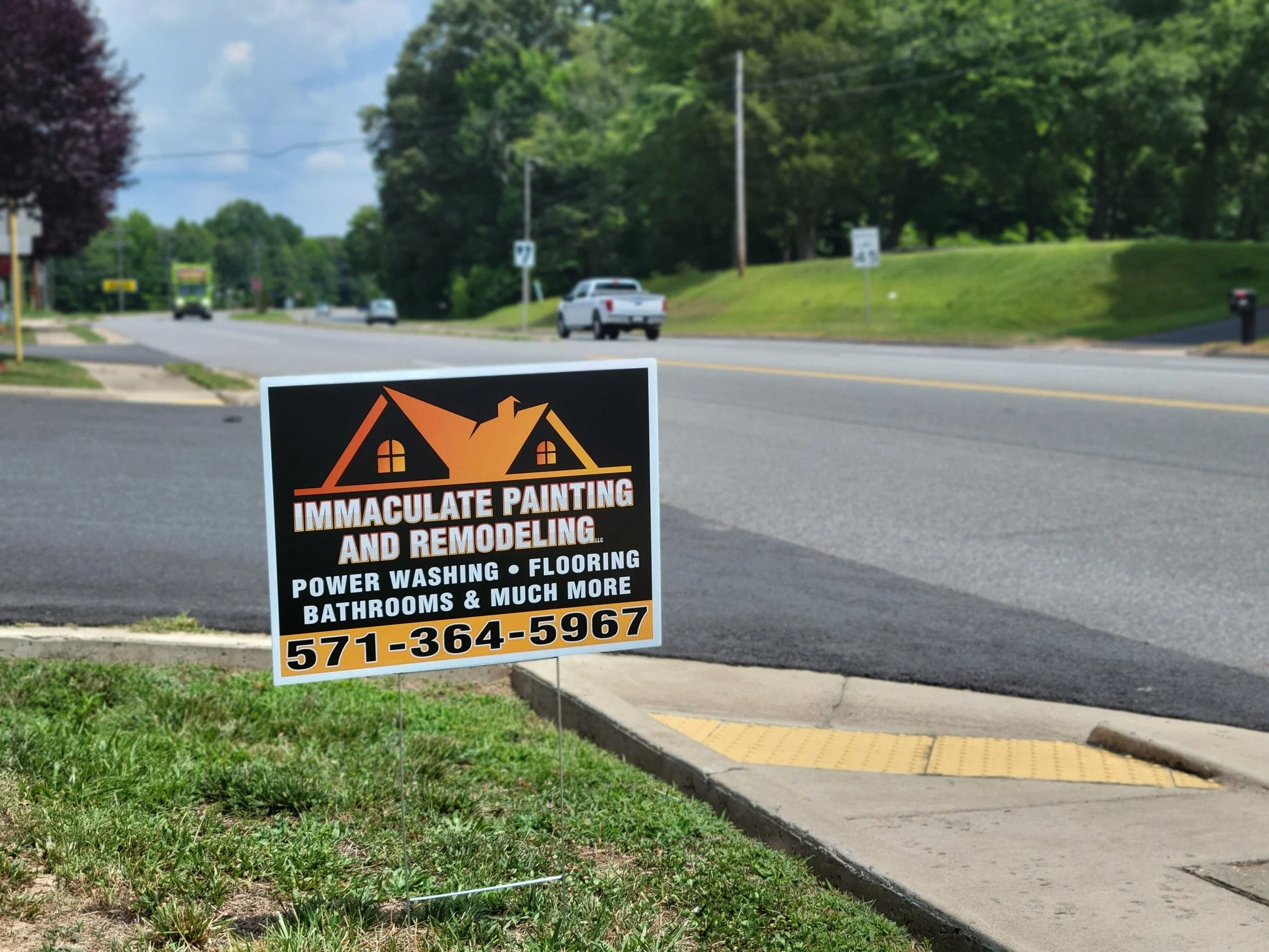 Yard Sign with Step Stake advertising a house painting and remodeling service, with services including power washing, flooring, bathrooms, and more, along with a phone number.