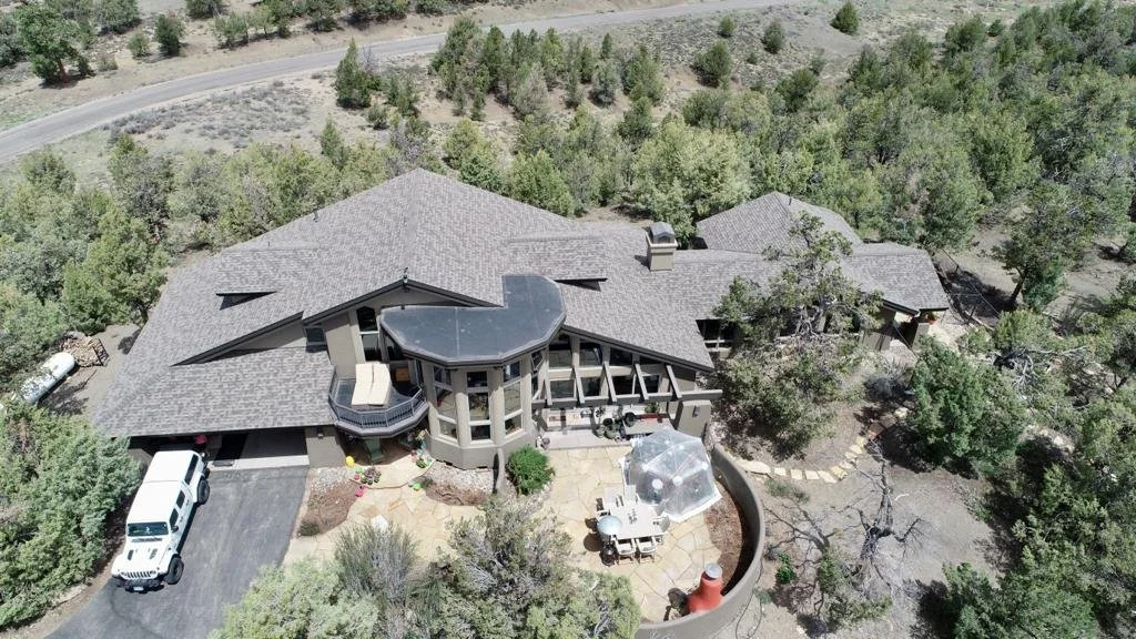 Completed asphalt shingle roof installed by SpearTip Roofing in South Florida