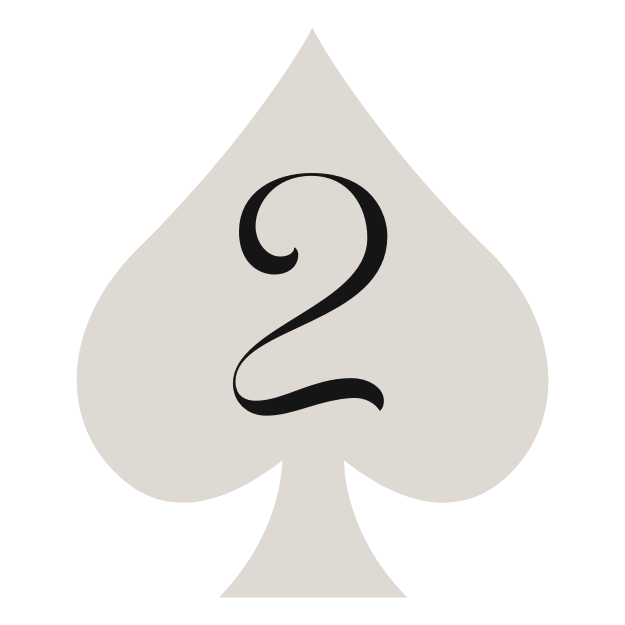 Scenic view of green rolling hills with a modern building, snow-capped mountains in the background, and a cloudy sky.