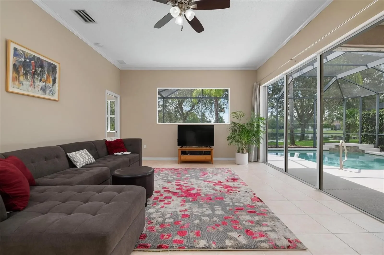 Before photo of living room in Lakewood Ranch  Florida home prior to custom cabinets and  interior styling by Kitt and Kaboodle