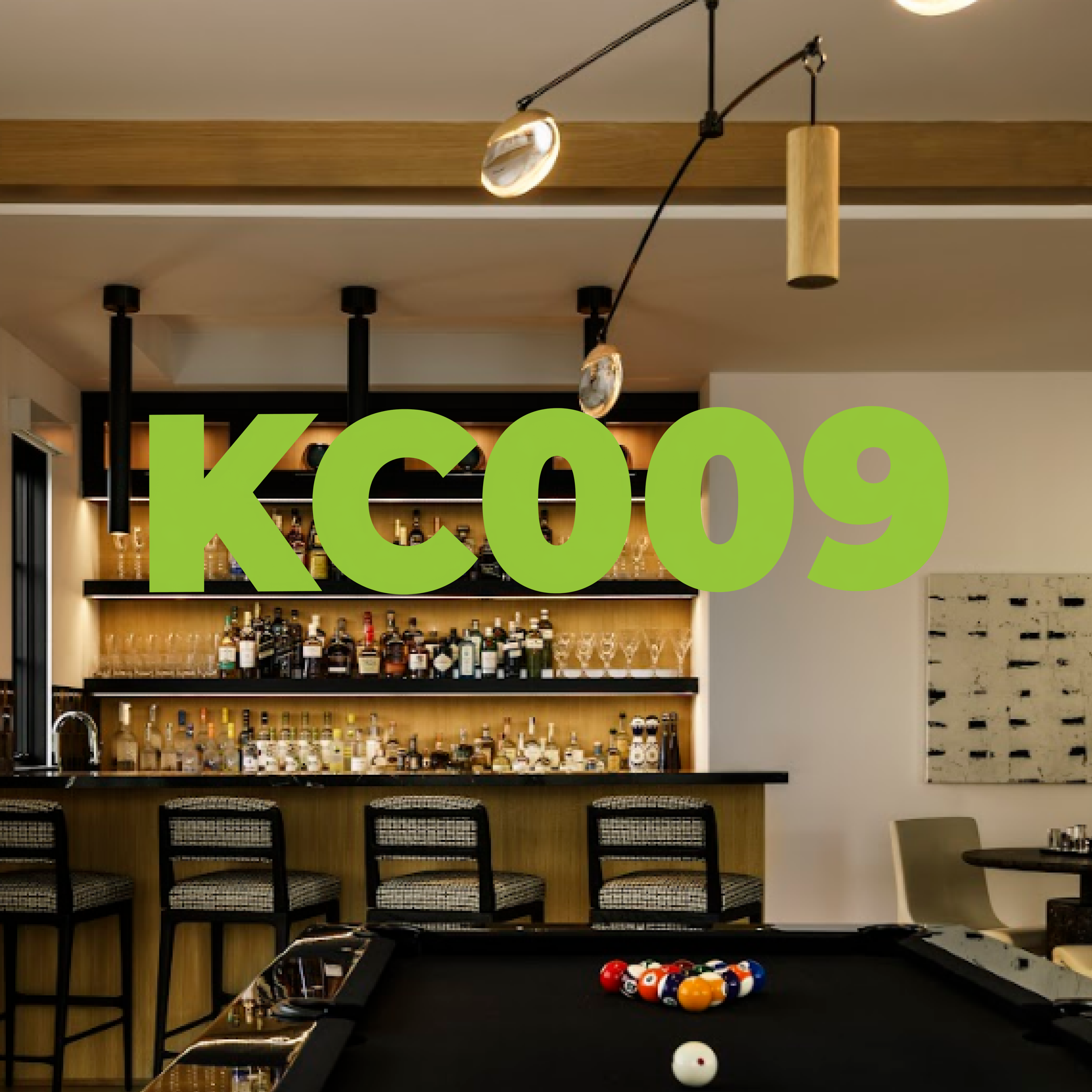 Interior of a modern bar with a pool table in the foreground, liquor bottles on shelves behind the bar, and seating area with chairs. Large green text 'KCO09' overlays the image.