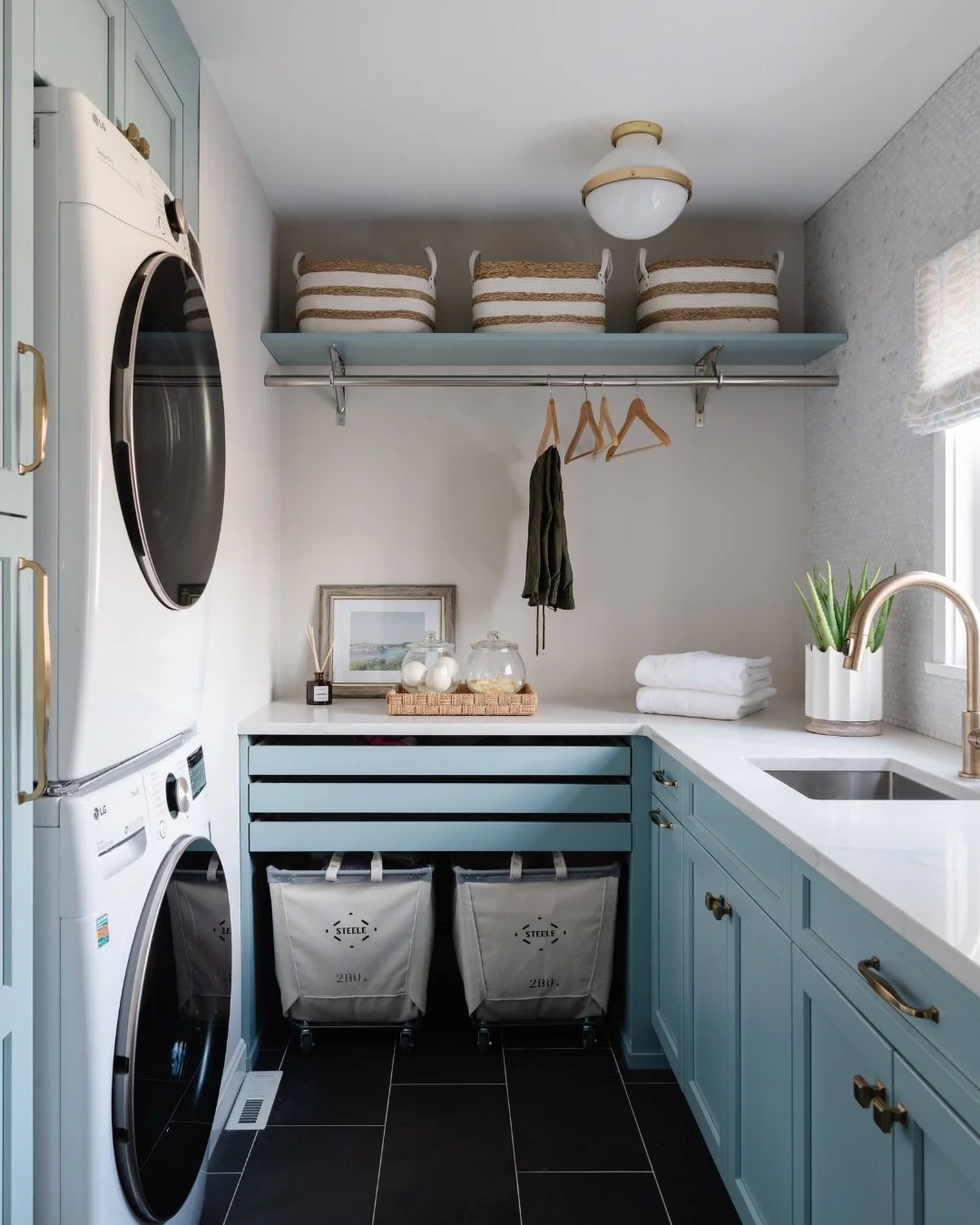 Leveling up, or finally growing up, is having a laundry room where no one will disturb you.

Where all your storage is tucked away in beautiful cabinetry and perfectly labeled totes.
 Where the sink is deep enough to actually pre-treat stains&mdash;w