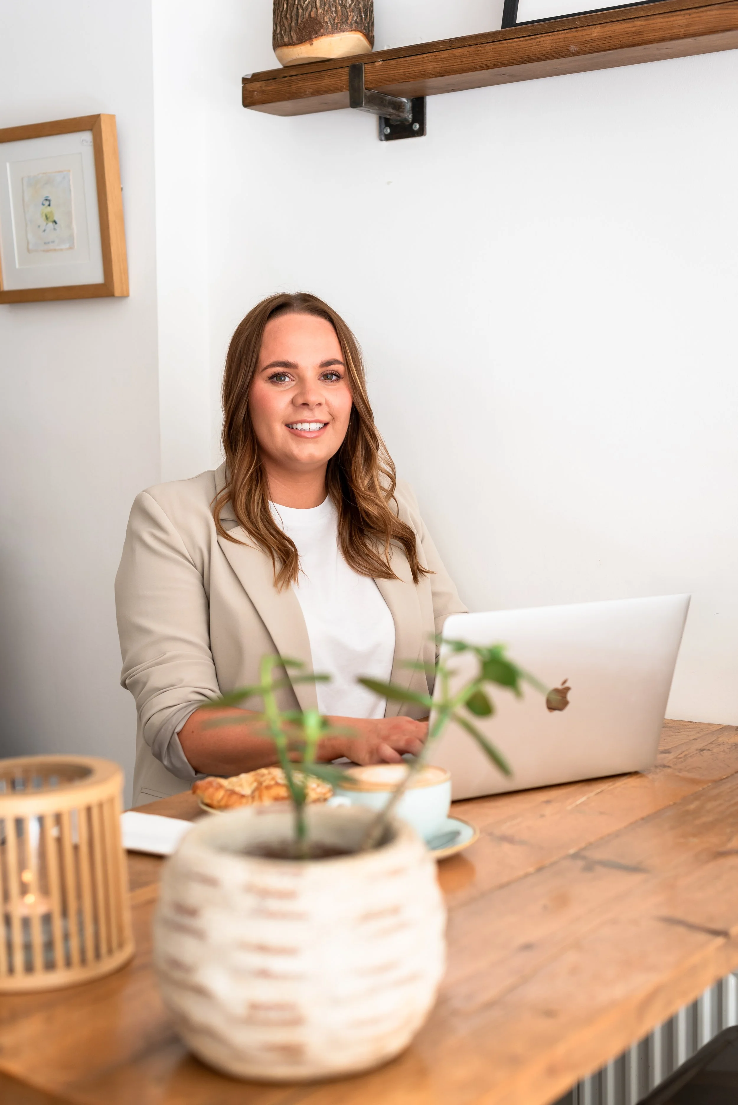 Grace from Silver Lining Social working on her laptop and planning digital marketing content