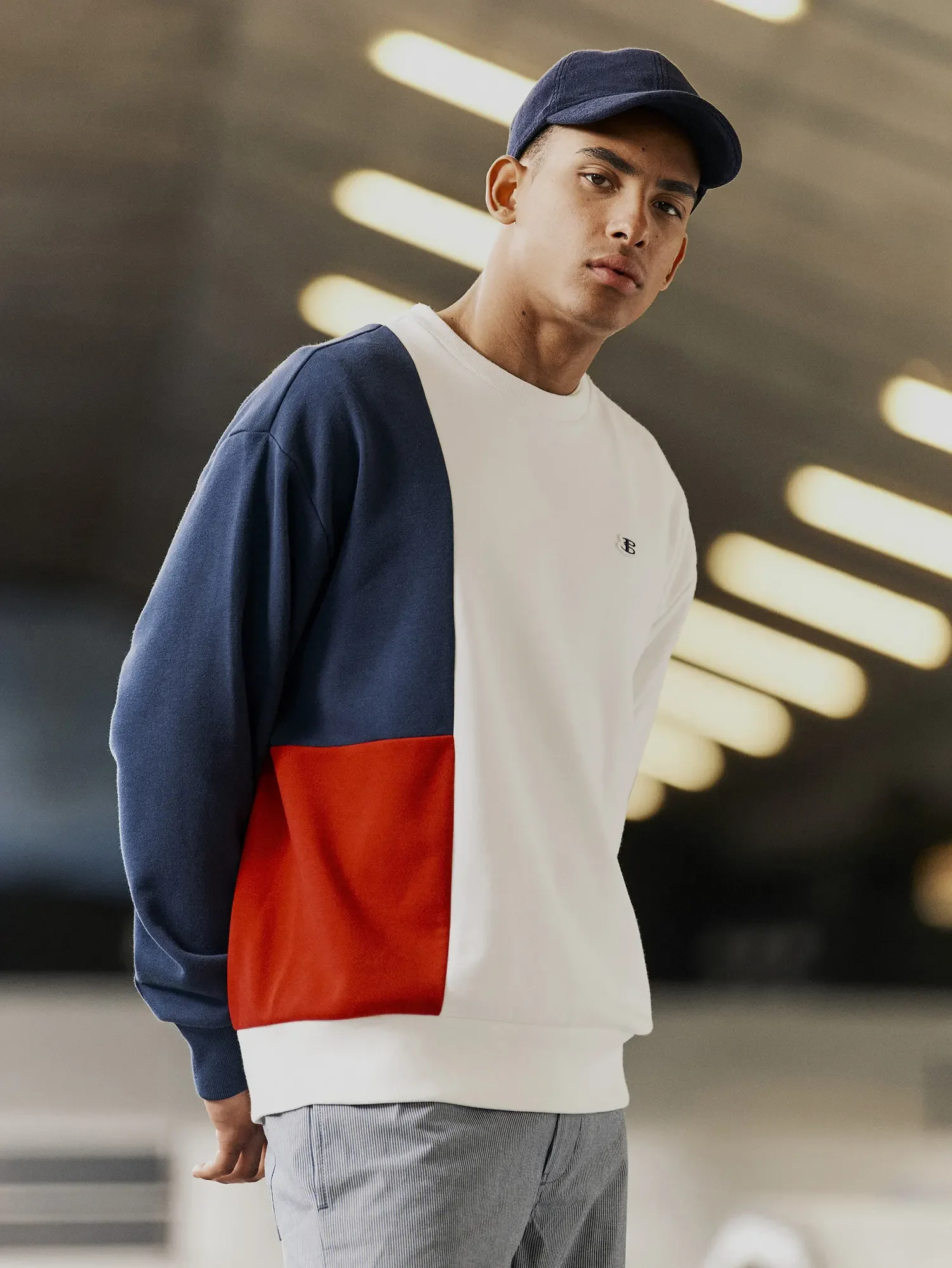 ecommerce-photography-mens-colour-block-sweatshirt-on-model-lifestyle.webp