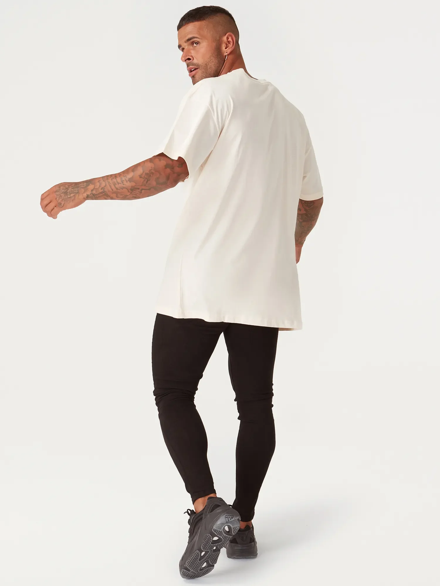 ecommerce-photography-mens-white-oversized-tshirt-black-jeans-on-model.webp