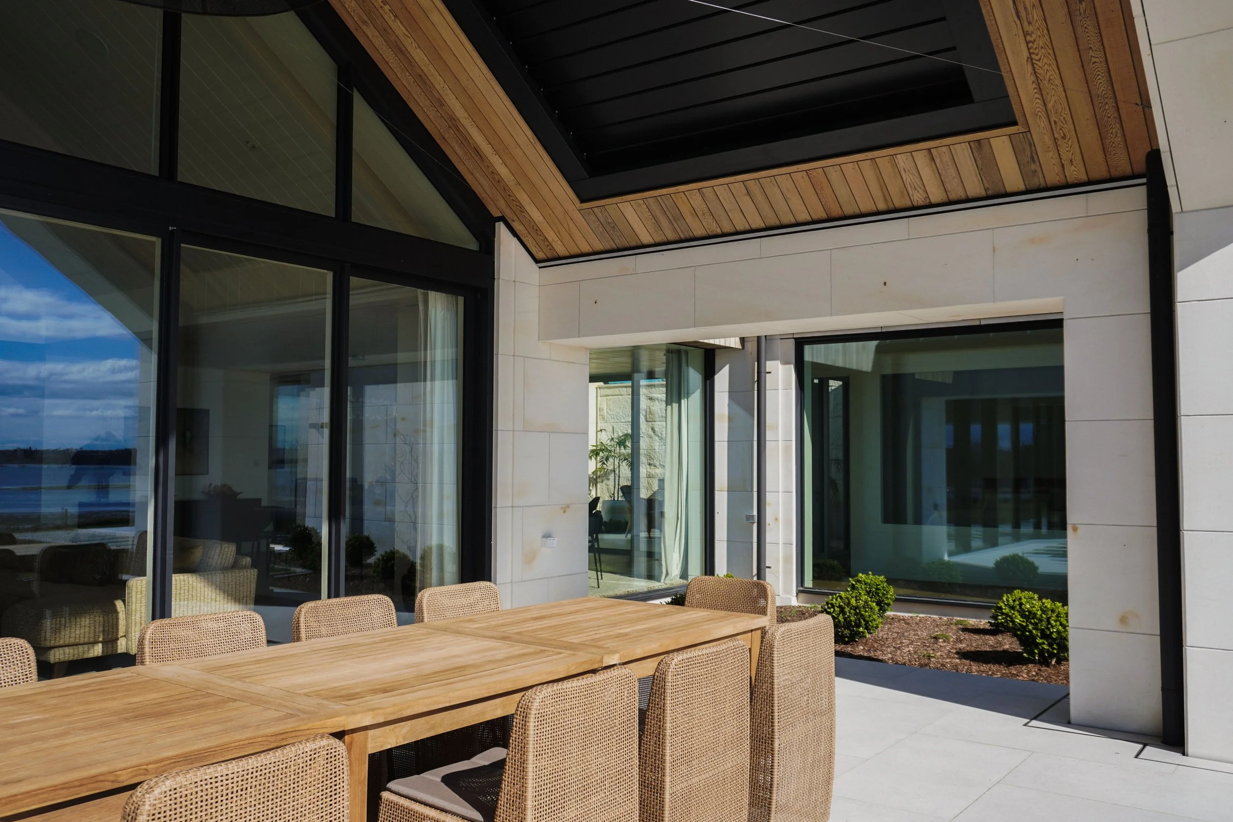 Outdoor living area of Harbour View Tauranga home connecting seamlessly to indoor spaces