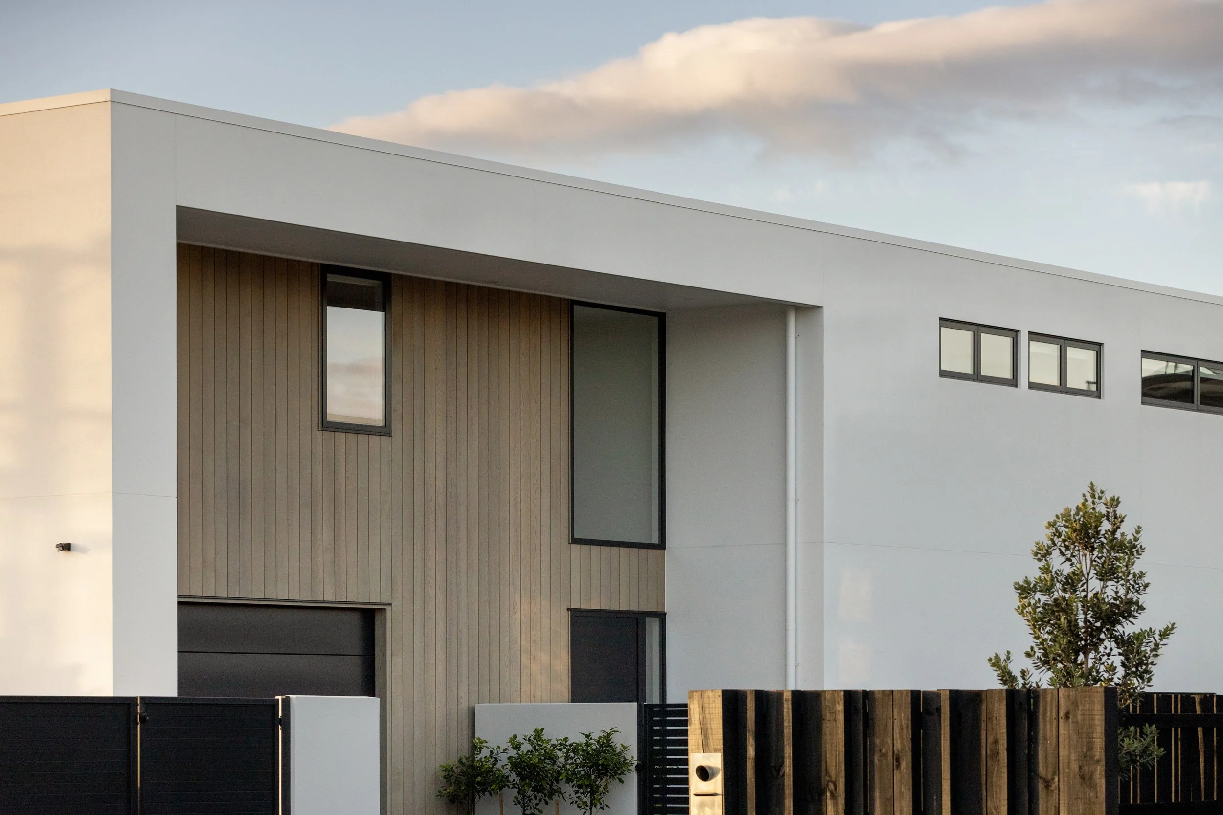 Roadside facade of Beachside Minimalism Tauranga home showcasing minimalist coastal design