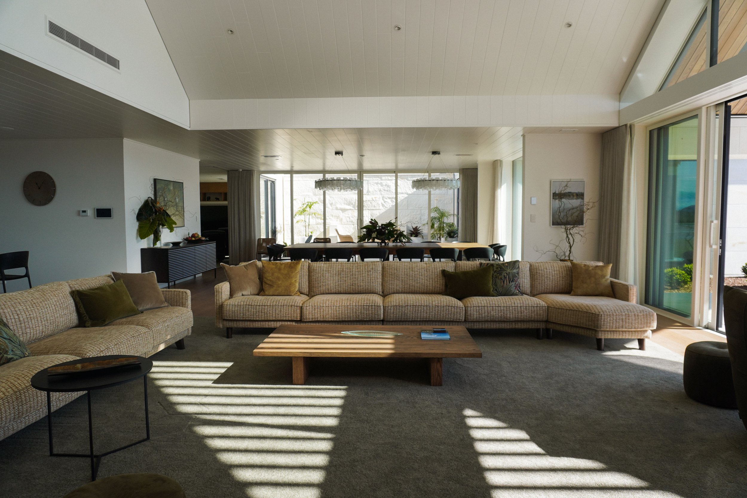 Open-plan living and dining areas in Harbour View Tauranga home for family gatherings