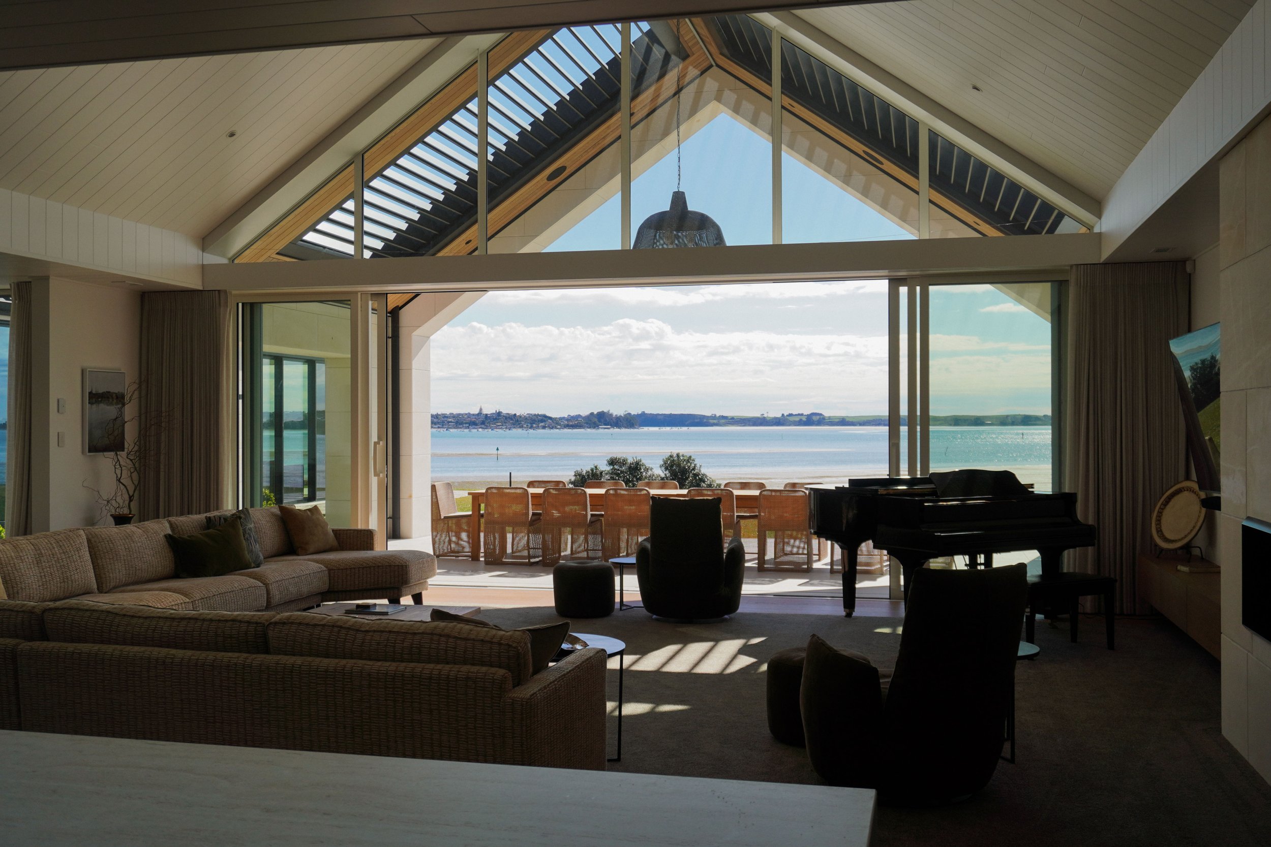 Open-plan living and dining areas in Harbour View Tauranga home for family gatherings