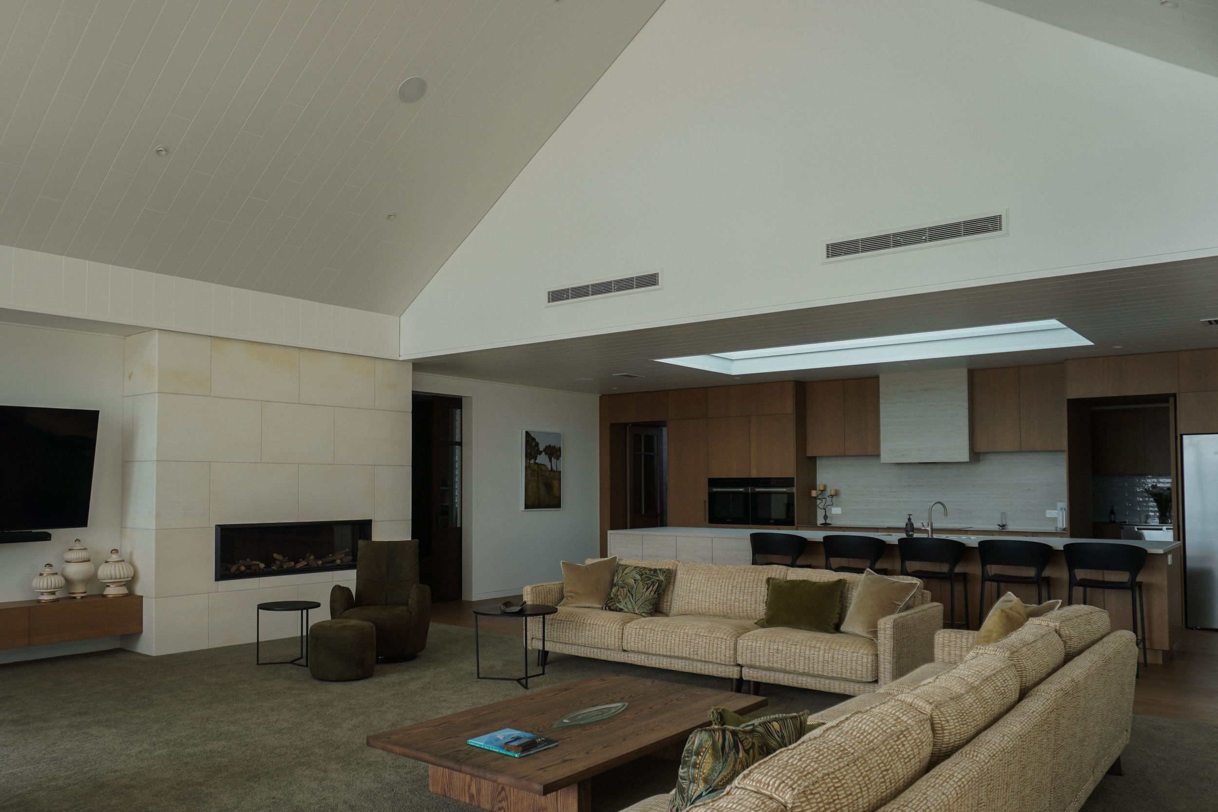 Open-plan living and dining areas in Harbour View Tauranga home for family gatherings