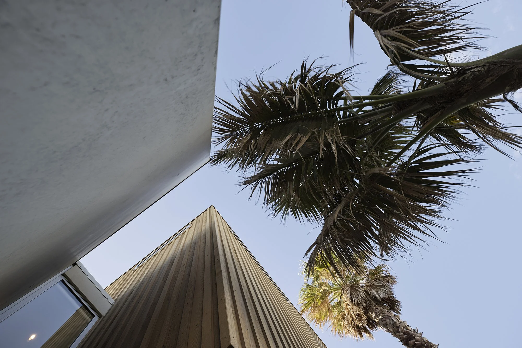 Exterior of Surf’s Edge Tauranga home featuring contemporary coastal design