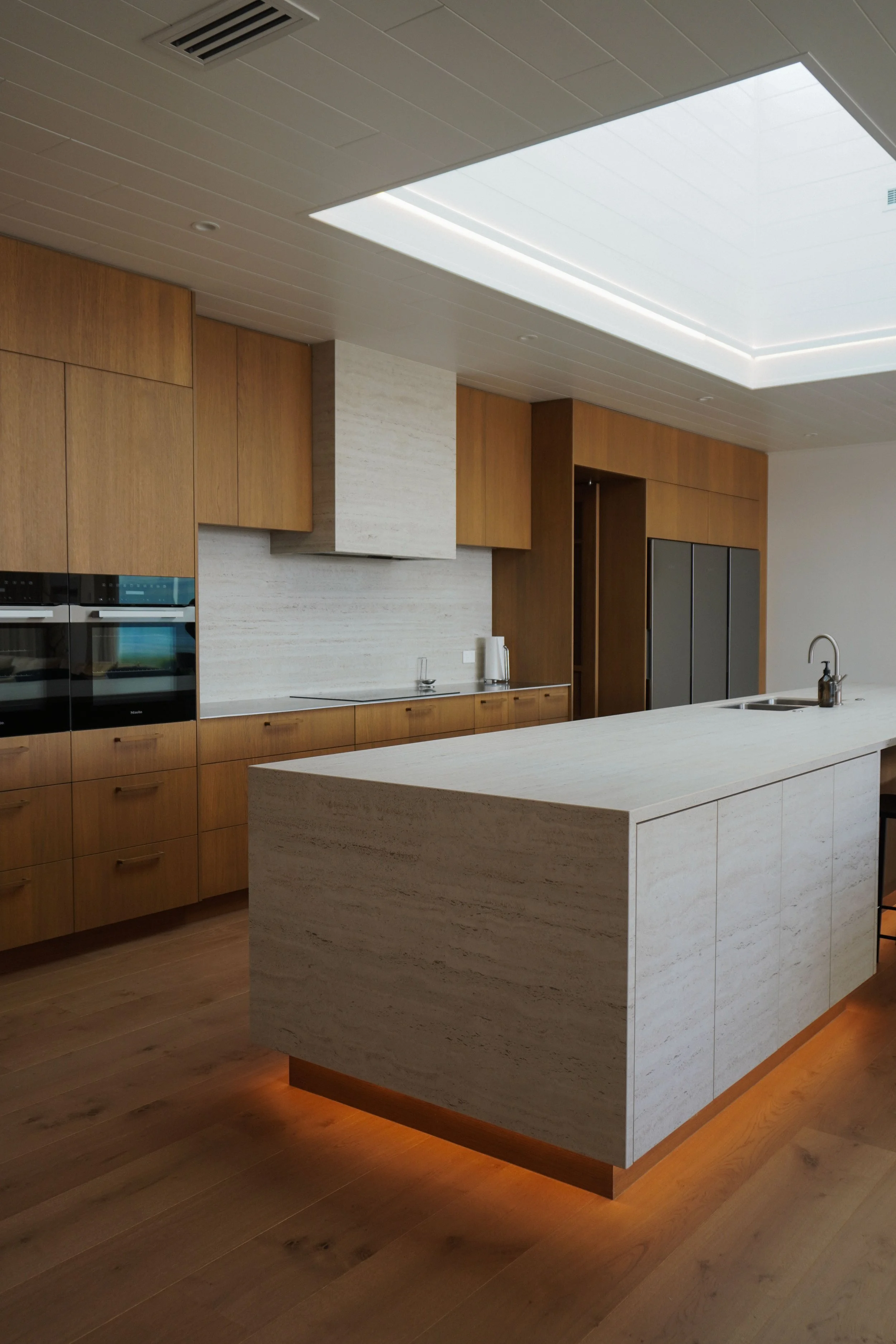 Kitchen in Harbour View Tauranga home designed for communal meals and celebrations