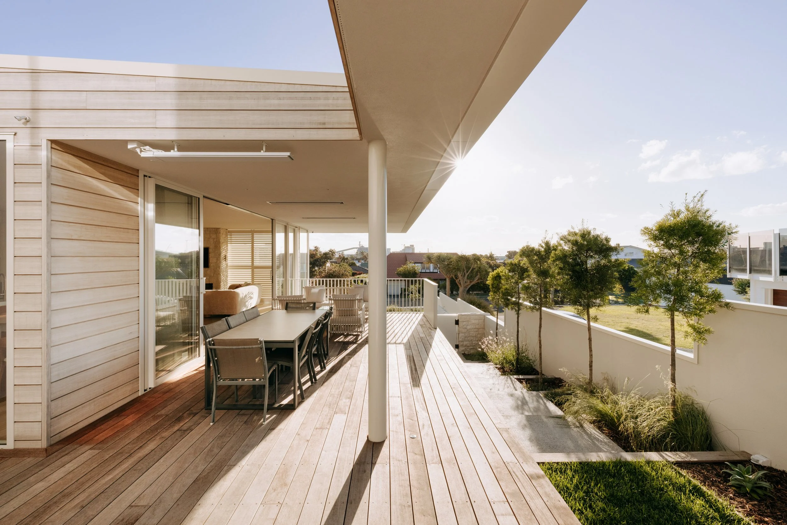 heltered outdoor living area with eave overhang in Palm Springs Mount Maunganui home renovation