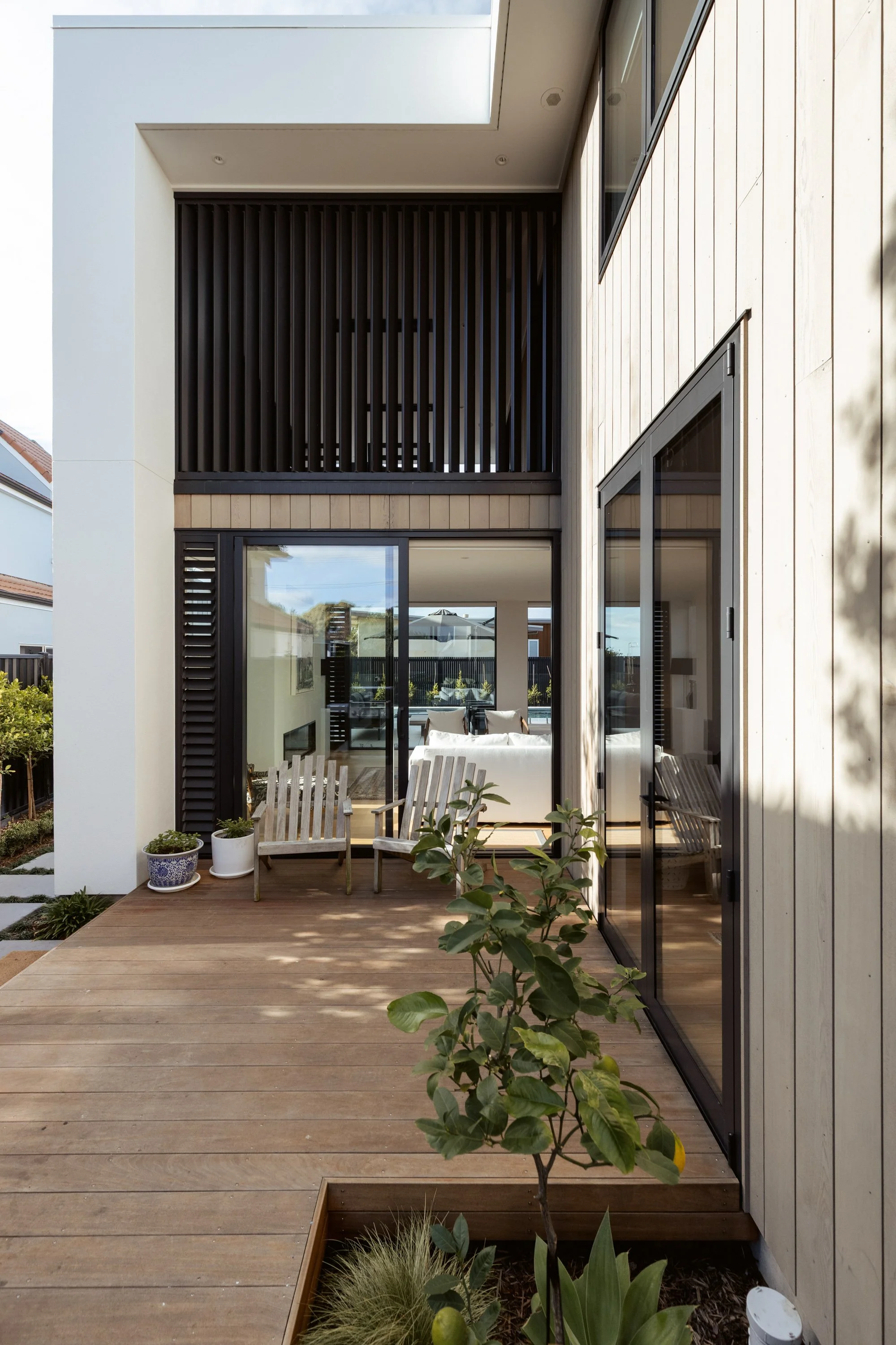 Outdoor living area of Beachside Minimalism Tauranga home with indoor-outdoor connection