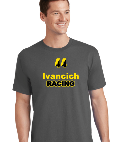 A man smiling, wearing a dark gray t-shirt with the number 44, the name Ivancich, and the word Racing printed on it.