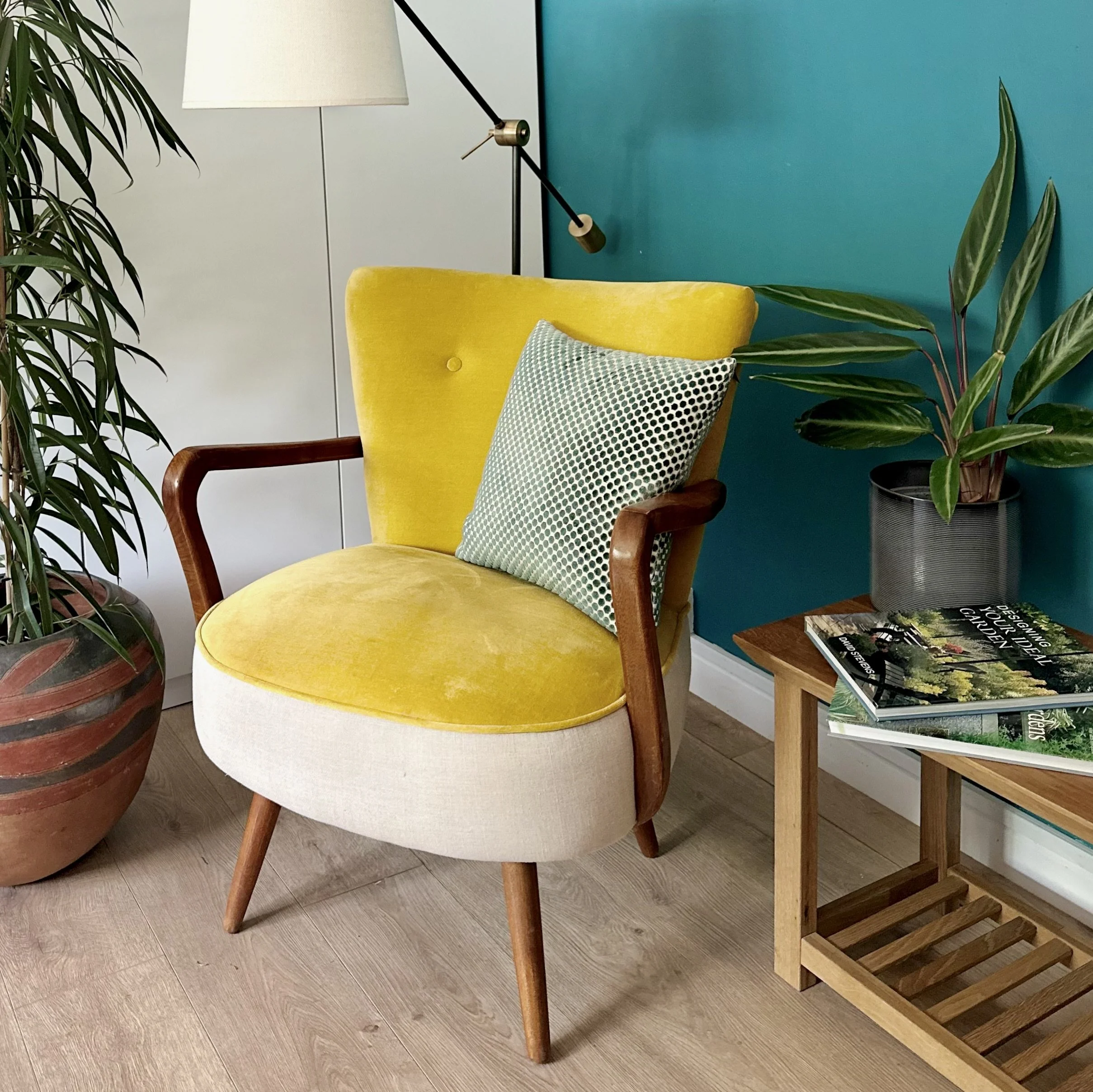 Image of a decluttered, cleaned and styled room featuring a stylish yellow chair and house plants, market ready for sale