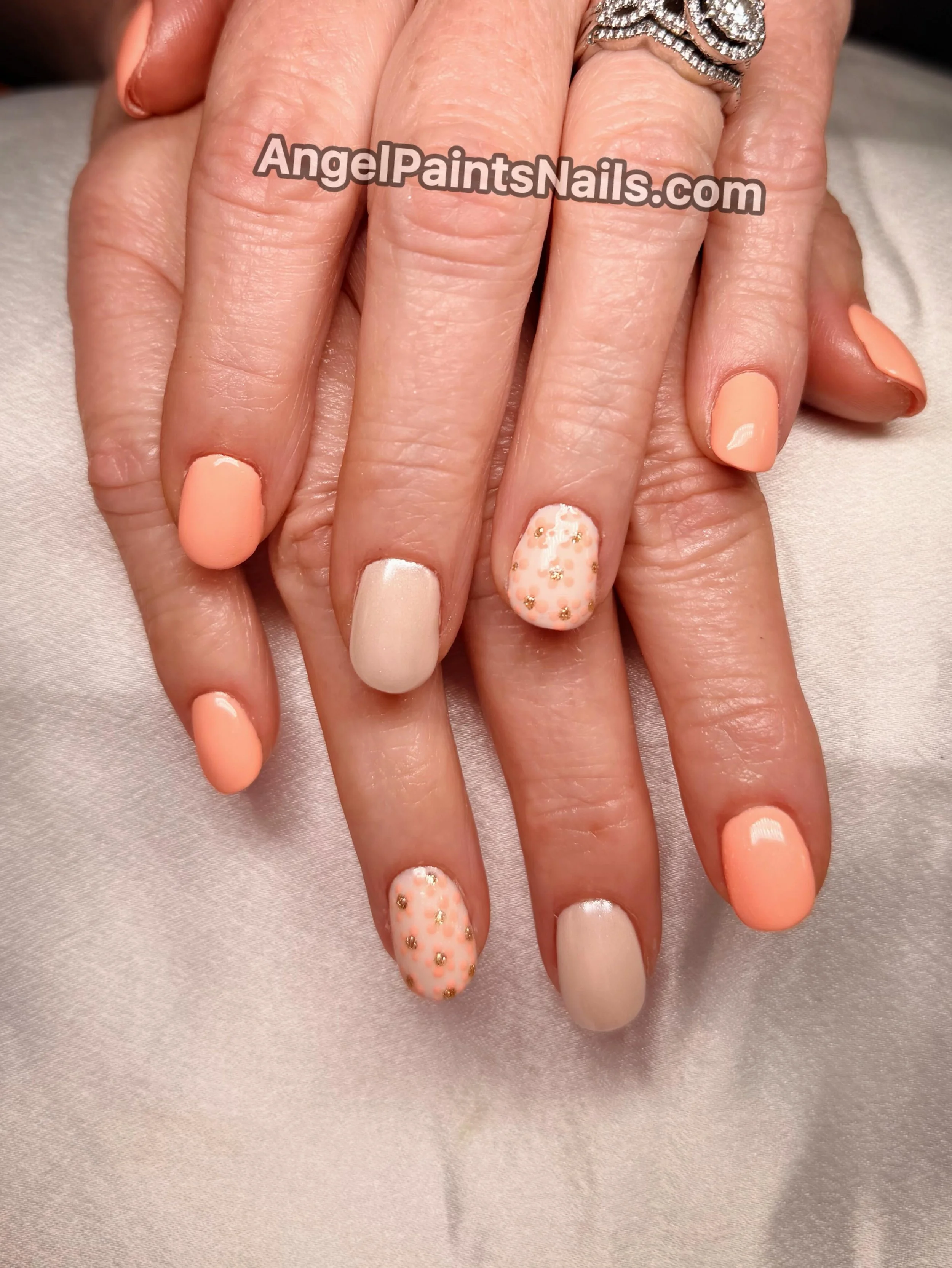 Orange floral nails with a little bit of chrome. 💅 
AngelPaintsNails.com