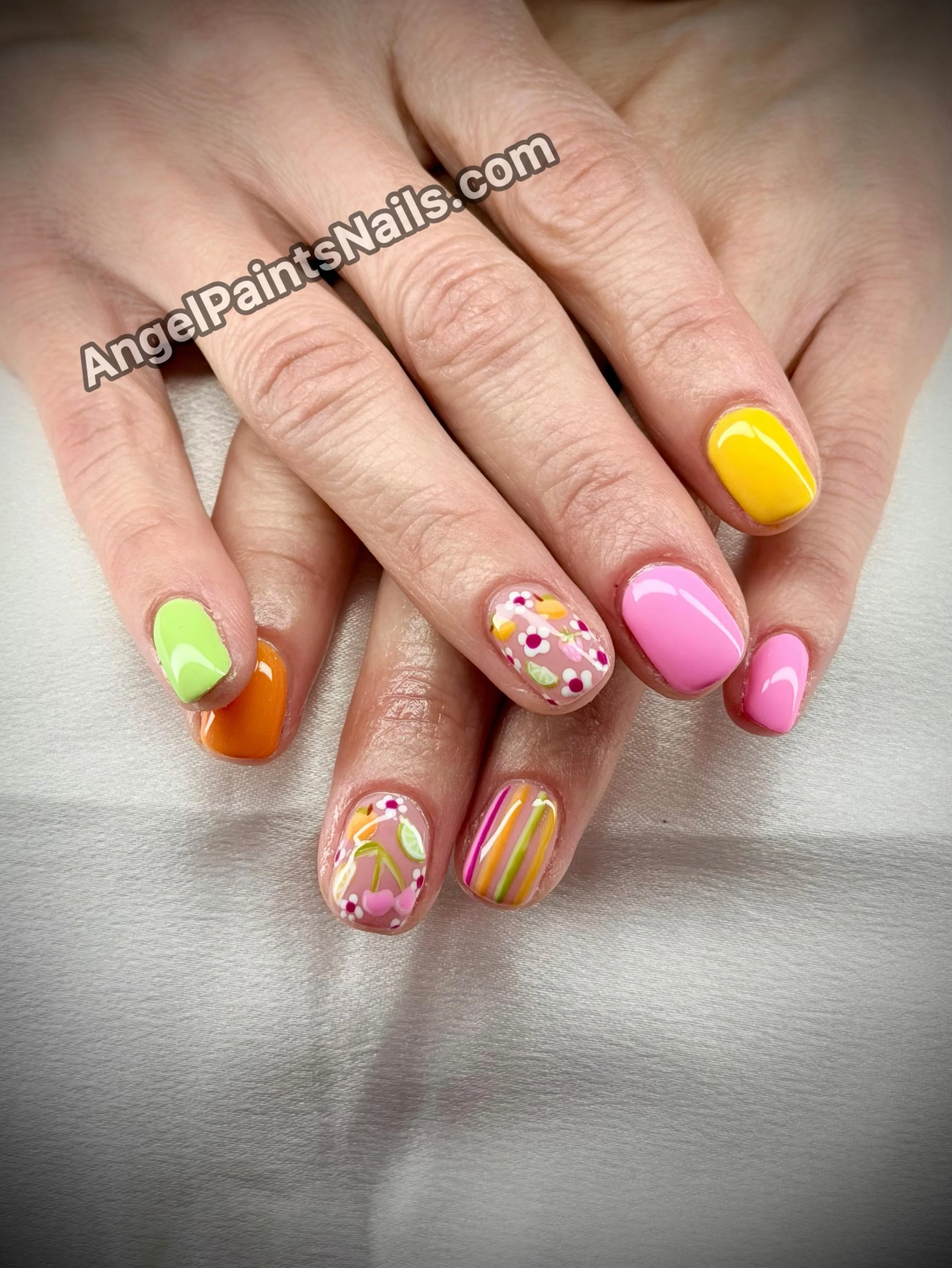 Adorable teeny tiny fruit nails!
AngelPaintsNails.com