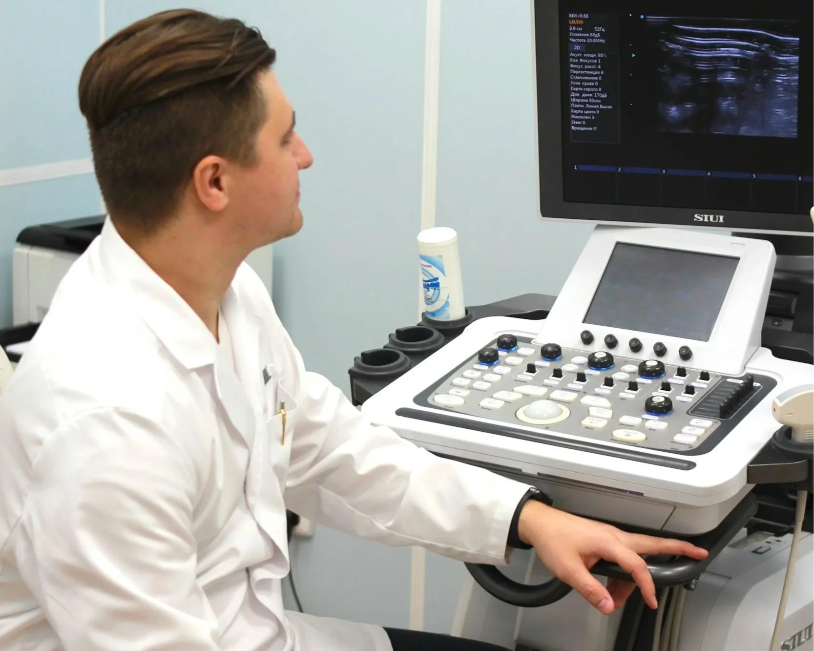 Certified sonographer performing a diagnostic ultrasound exam in a Saskatoon medical clinic