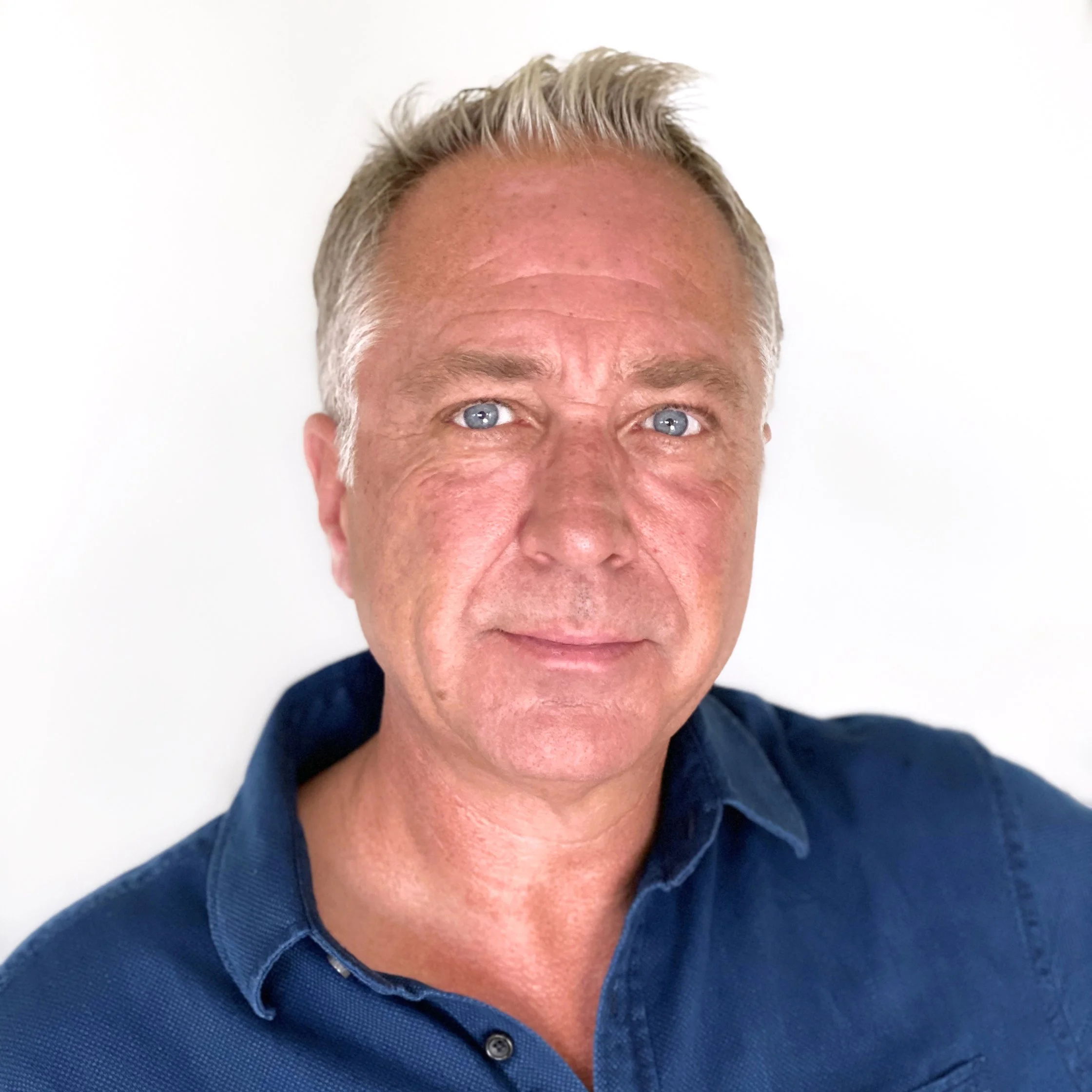 David Swanson wearing a blue collared shirt.