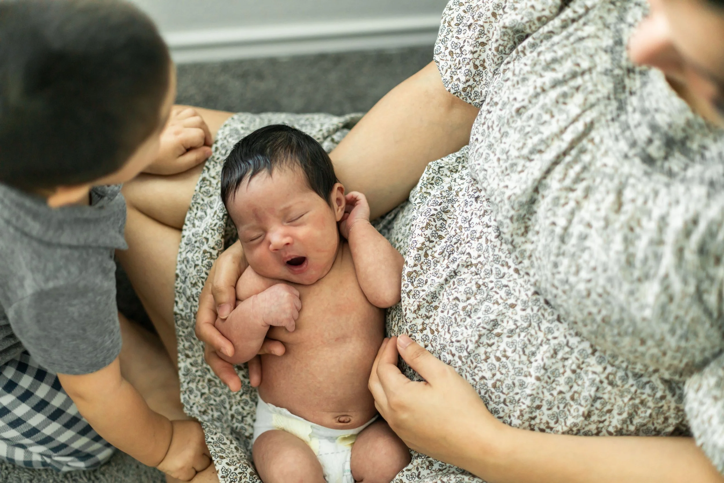 Family photographed together during a newborn photography session in Houston