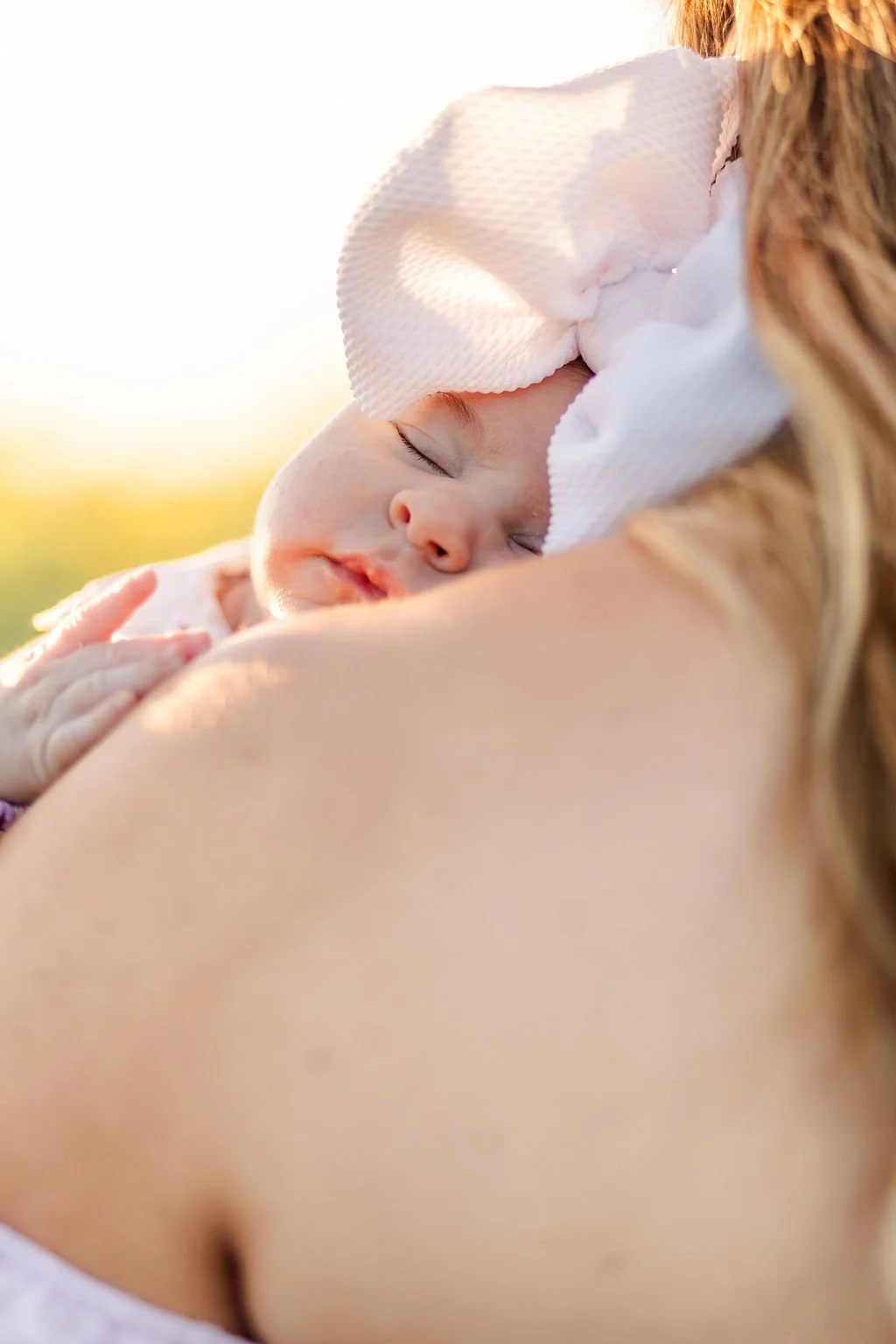 Mother holding her newborn baby during a Houston newborn photography session