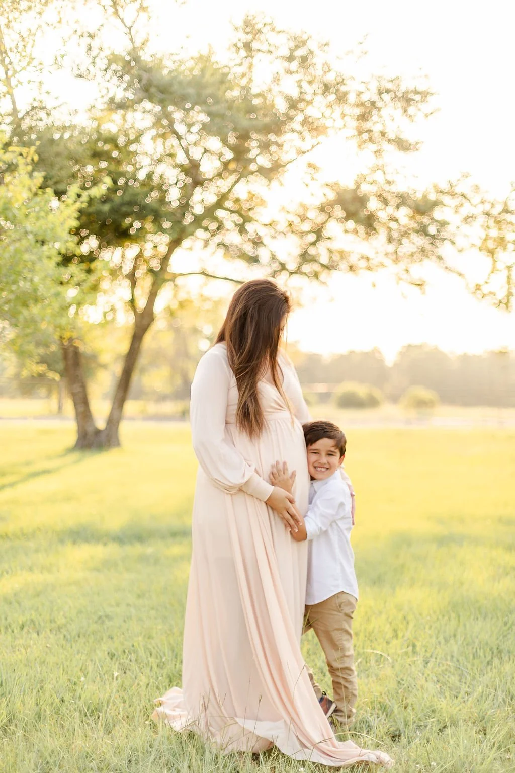 Expecting mother photographed during an outdoor maternity session in Houston