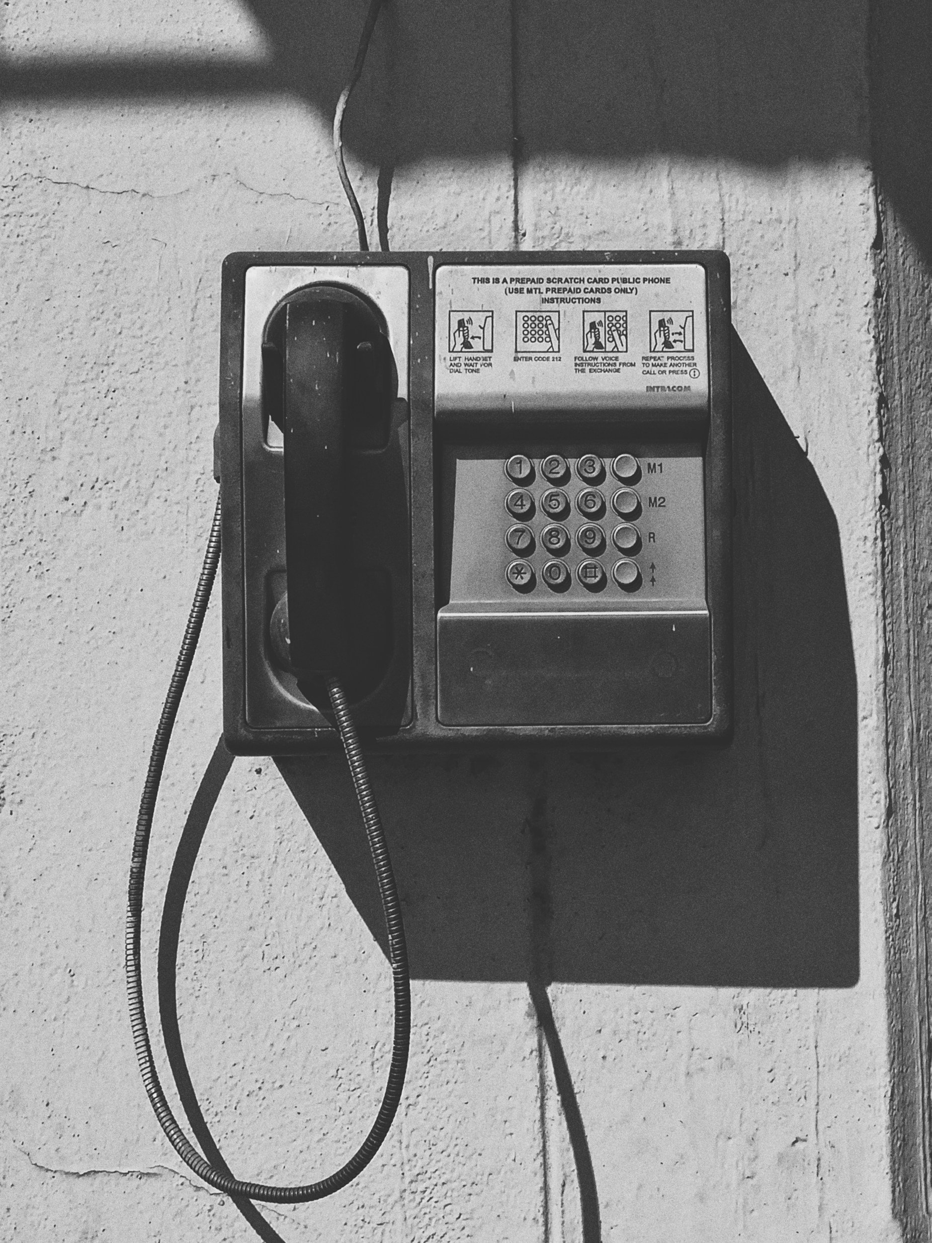 Vintage payphone black and white