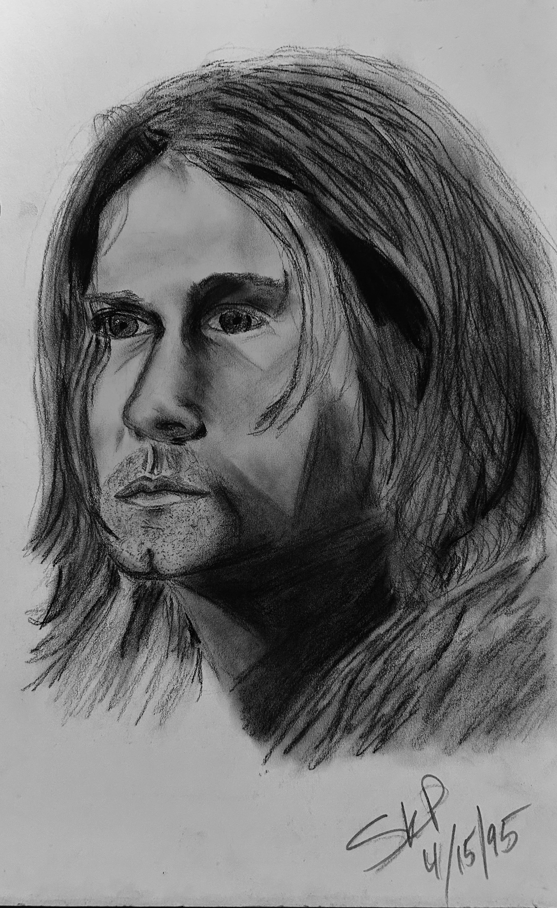 A realistic, pencil and charcoal drawing of Kurt Cobain, 1995