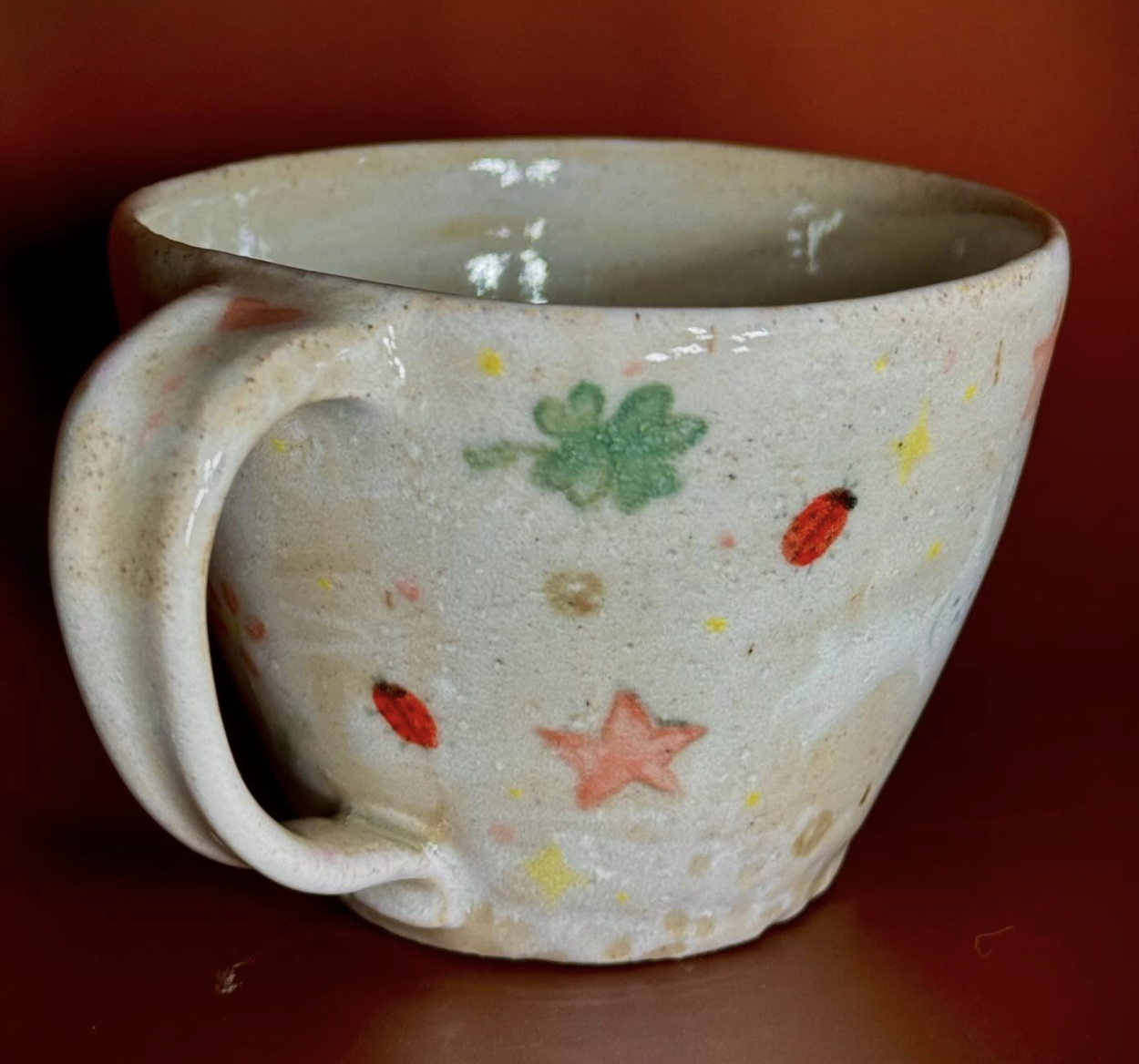 Back View of wheel thrown mug- by Carmen Casillas-Clay and underglaze