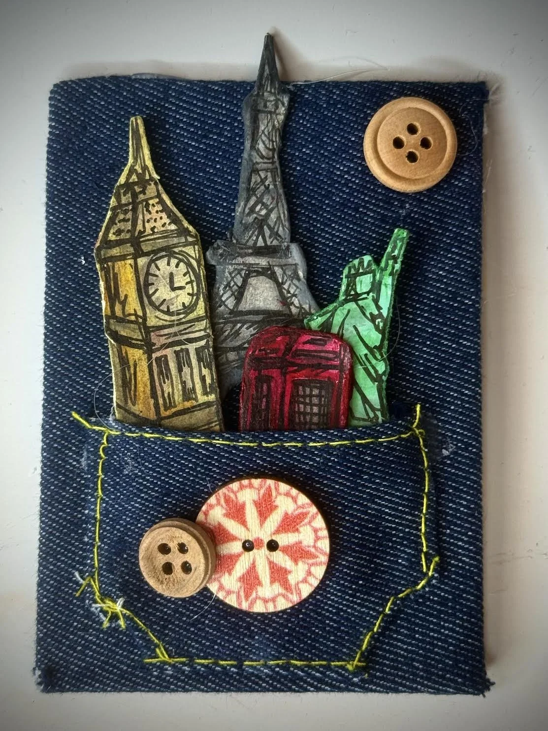 "In My Back Pocket" Relief Sculpture by Carmen Casillas-
Denim, cardstock, and buttons-
2x3 in.