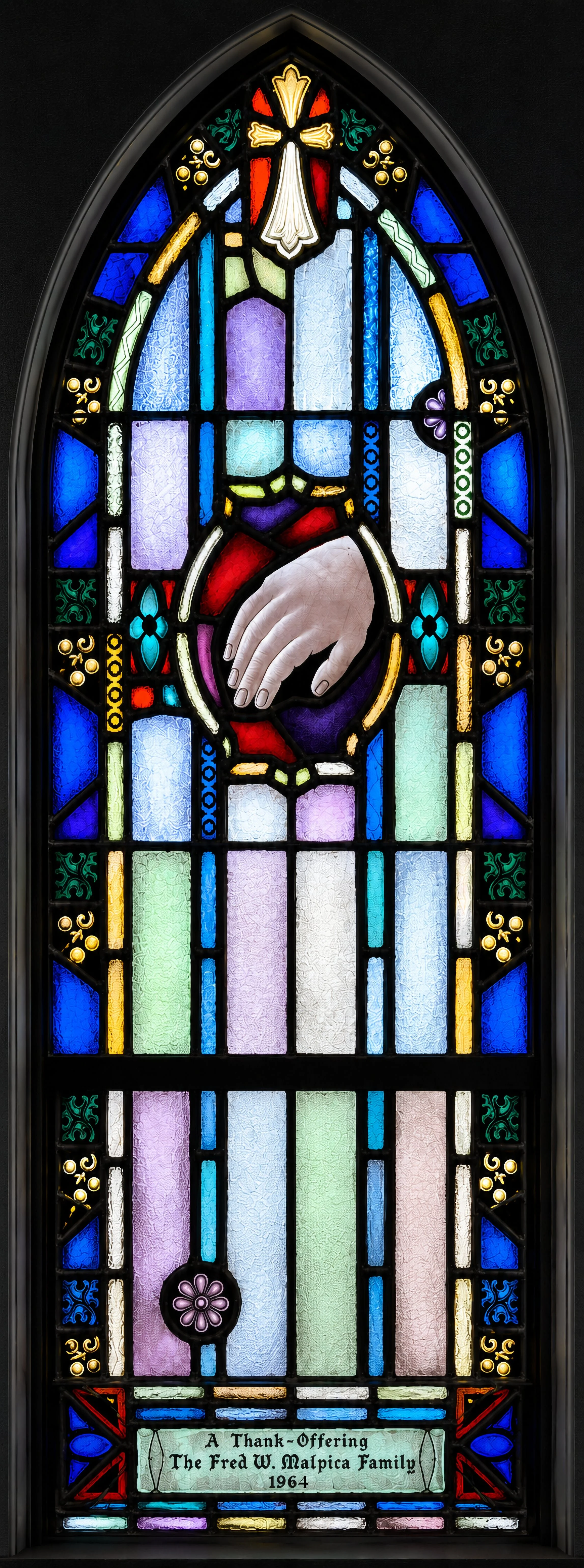 Healing Ministry. A hand recalls the many Gospel accounts of Christ healing by touch — a gesture the Church continues in the laying on of hands at Confirmation, Ordination, and services of healing.