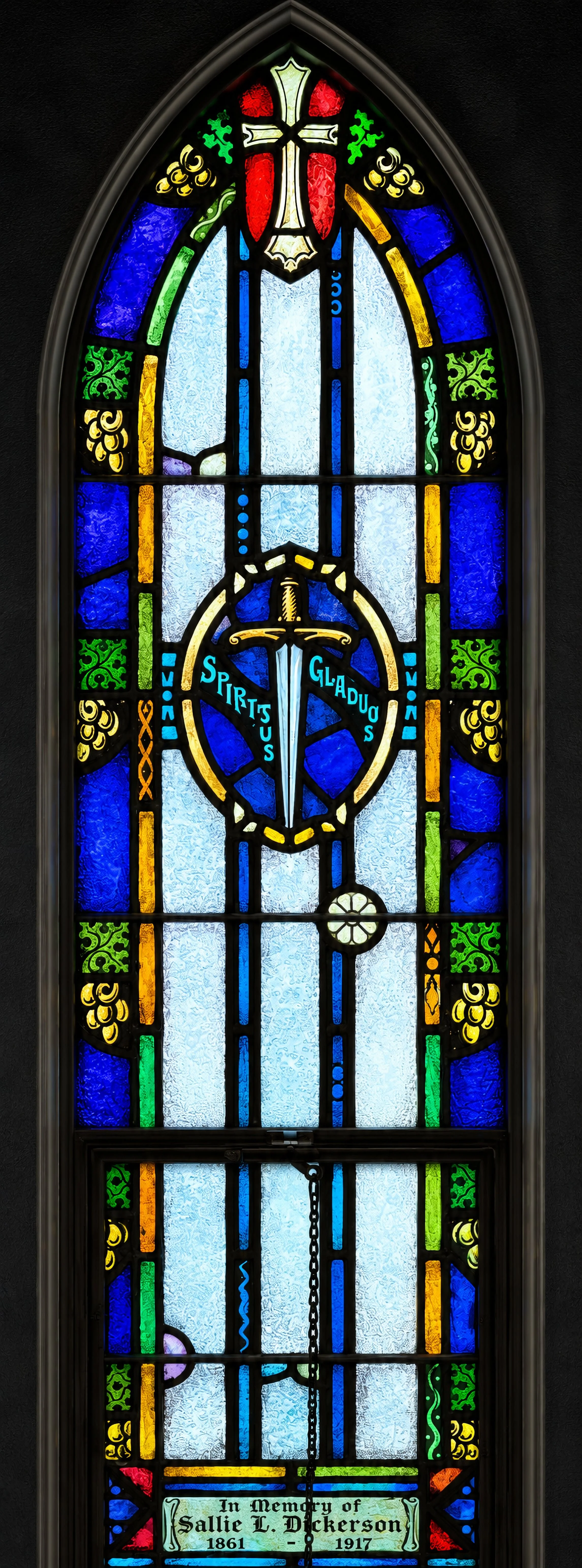 On the Prince Street side, the Sword of the Spirit (Spiritus Gladius) for St. Paul, who wrote of "the sword of the Spirit, which is the Word of God" (Ephesians 6:17).
