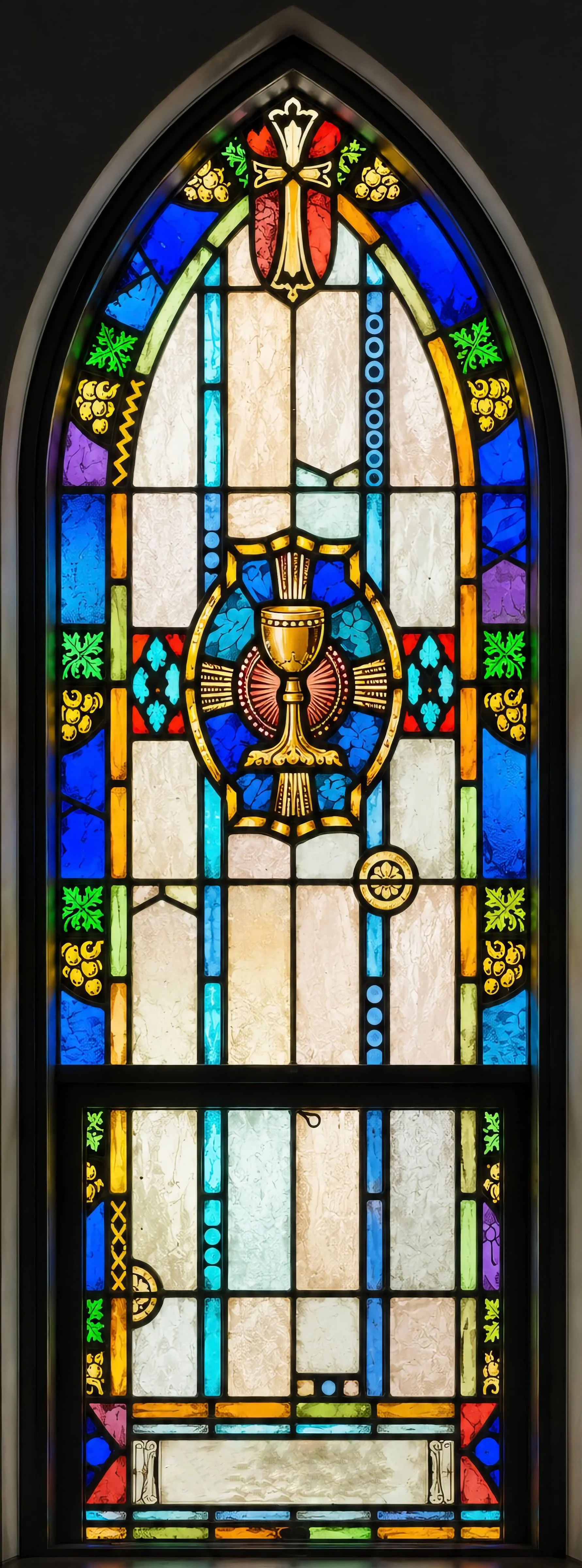 To the right, a chalice with paten for the celebration of Holy Communion.