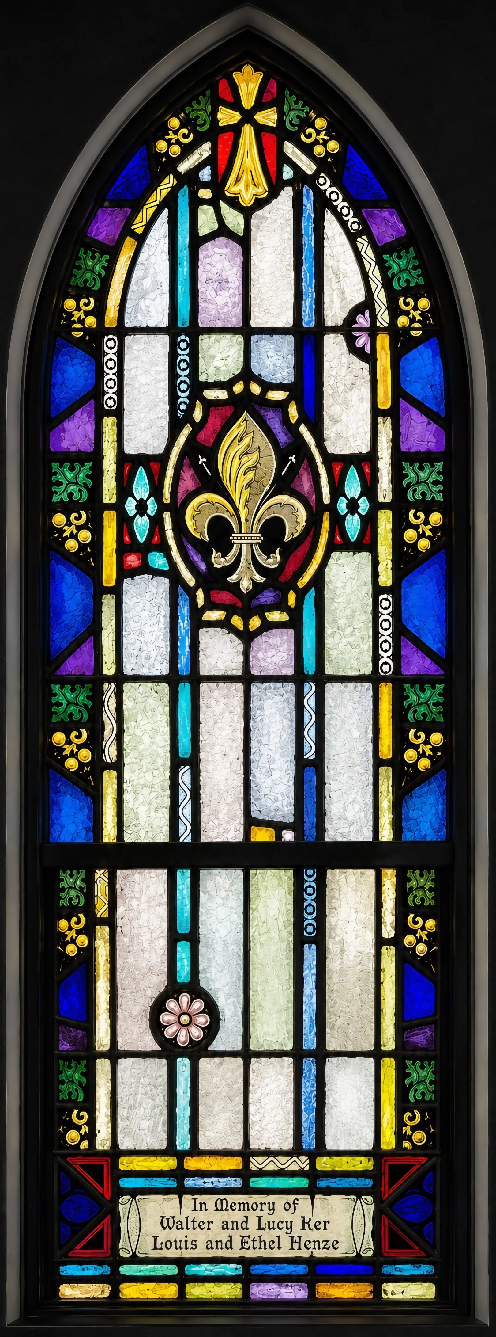 Annunciation. A fleur-de-lis — symbol of purity and royalty, traditionally associated with Mary — recalls Gabriel's announcement of Christ's coming birth (Luke 1:26–32).