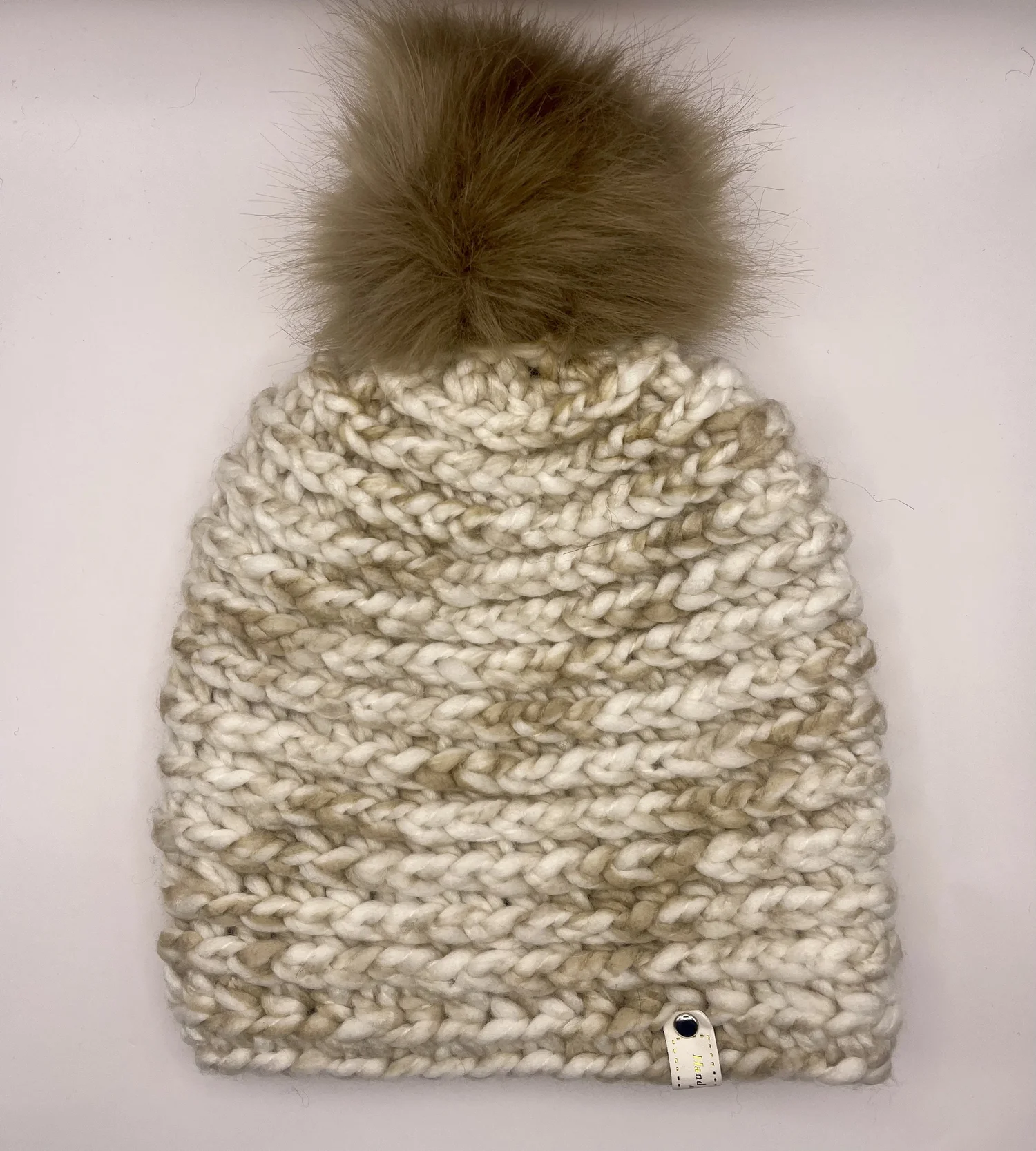 Beige and tan beanie with brown pom pom — Your Site Title