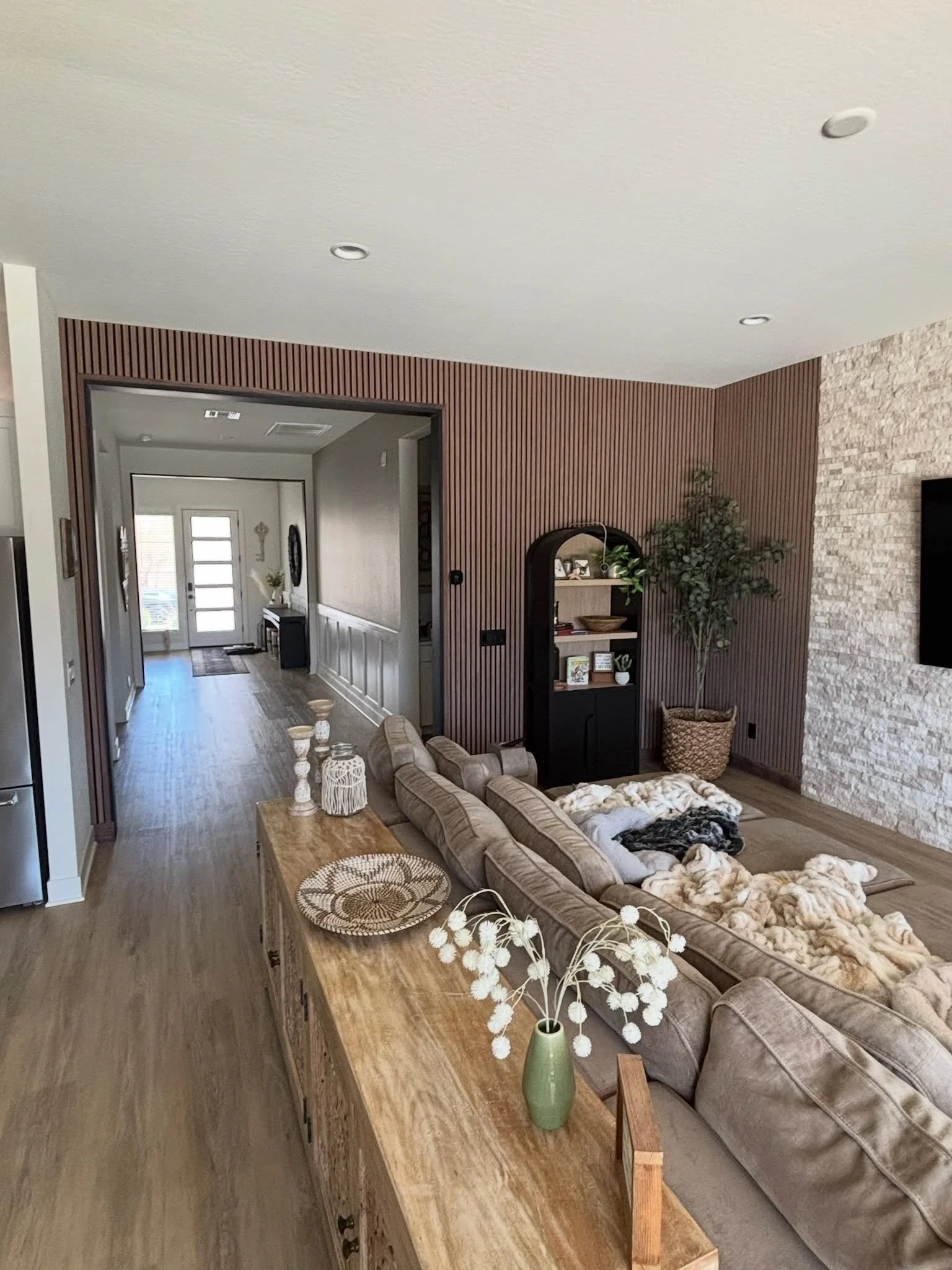 Medium Oak install with matching trim pieces. All outlets, switches, and thermostats rest seamlessly on top of our panels to fully integrate with your home!