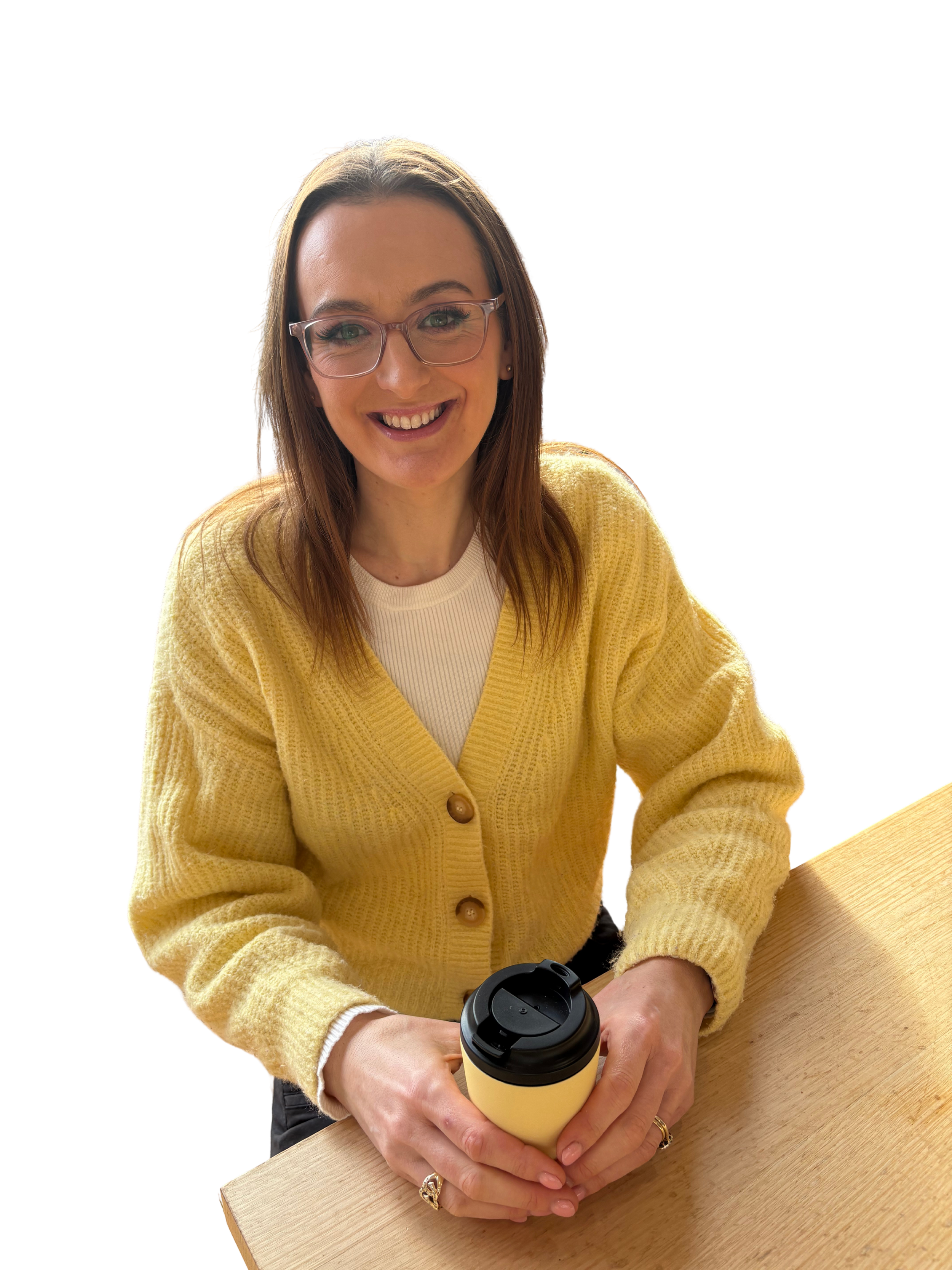 Jazmin Pursell sitting with tea, smiling