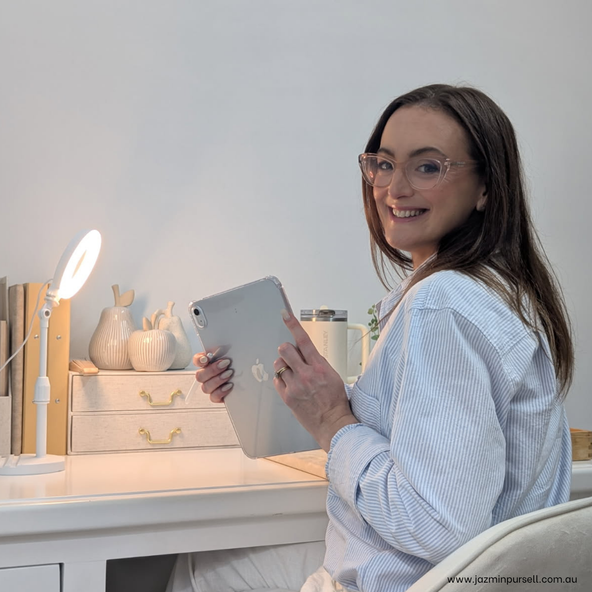Jazmin Pursell smiling and turning around, holding iPad