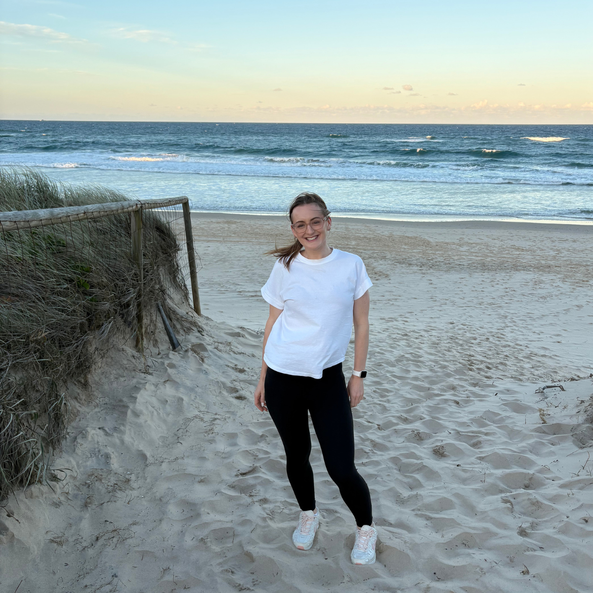 Jazmin Pursell standing smiling beach photo