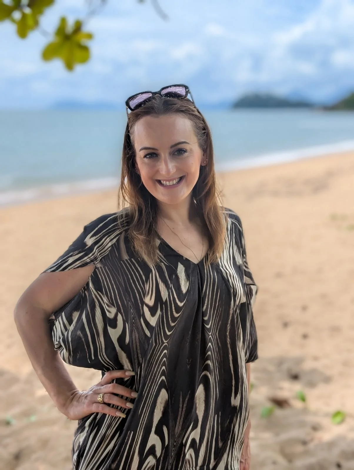 Jazmin Pursell standing on beach, smiling